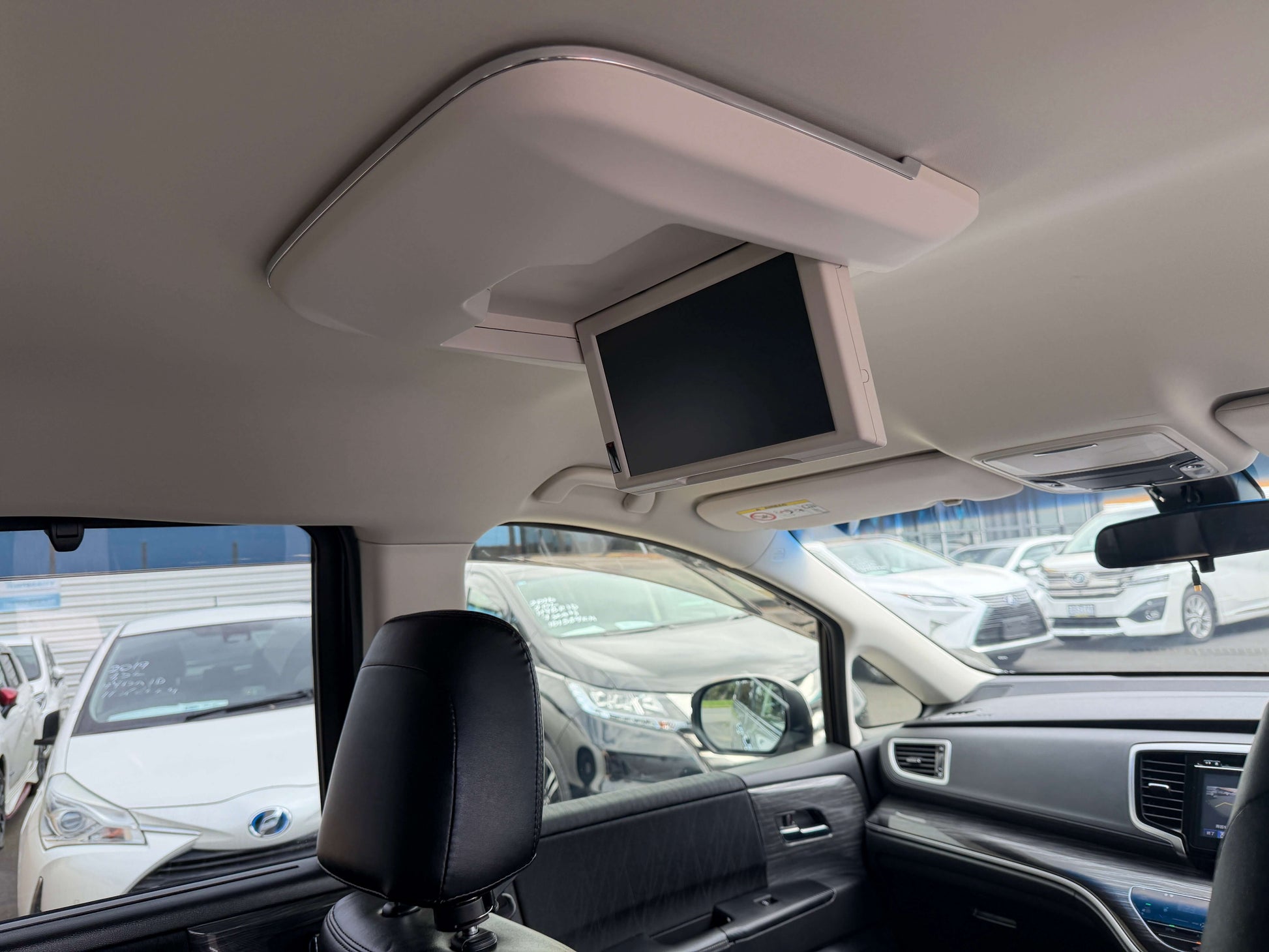 Interior view of a 2016 Honda Odyssey 2.0 Hybrid showing overhead entertainment screen.
