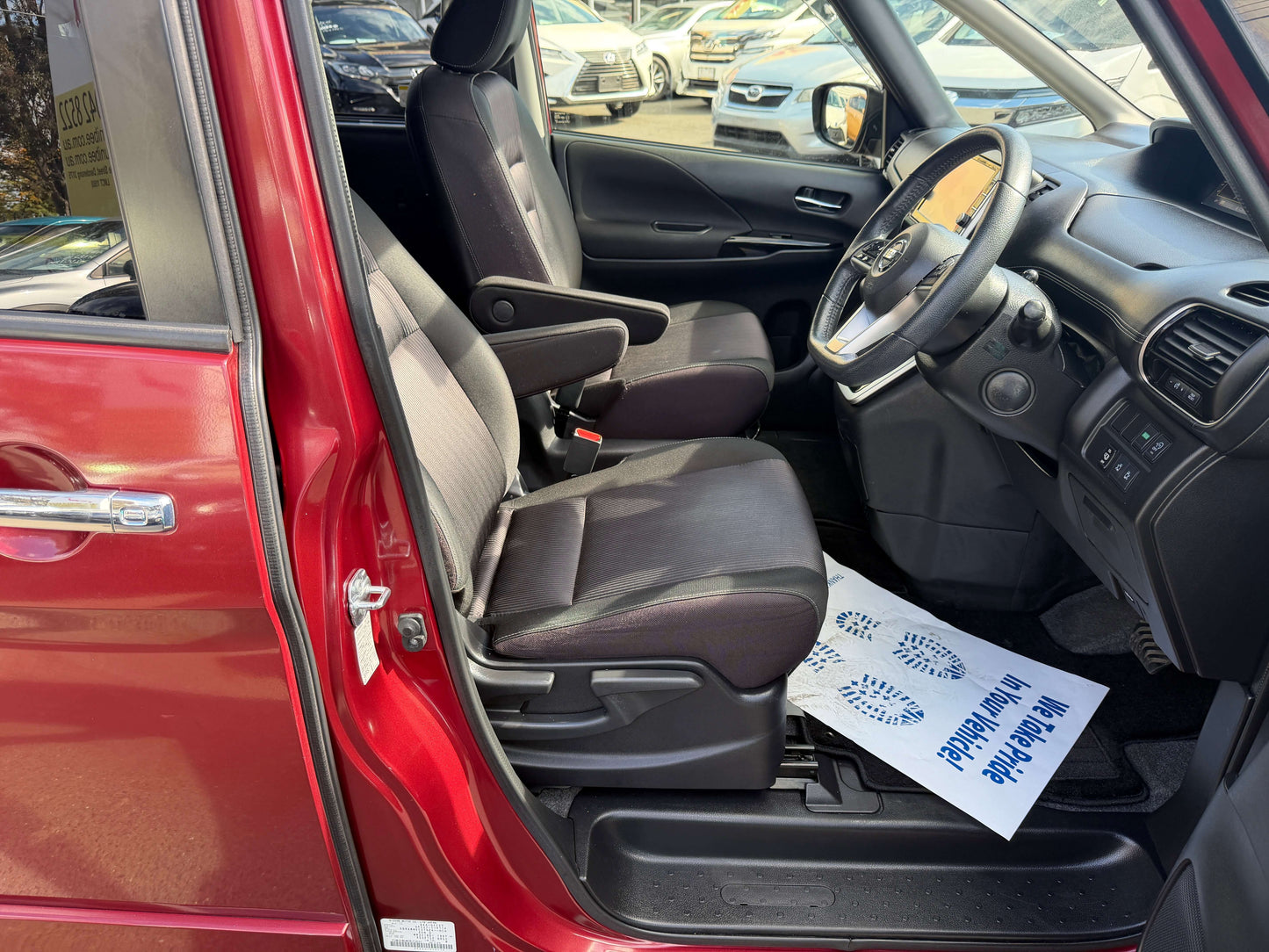 Interior view of a 2016 Nissan Serena 2.0L S-Hybrid showing front seats and dashboard.