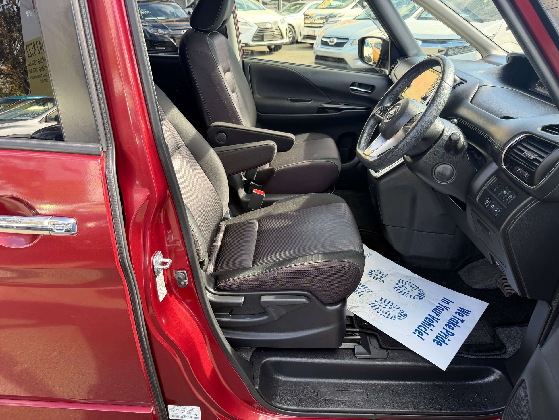 Interior view of a 2016 Nissan Serena 2.0L S-Hybrid showing front seats and dashboard.