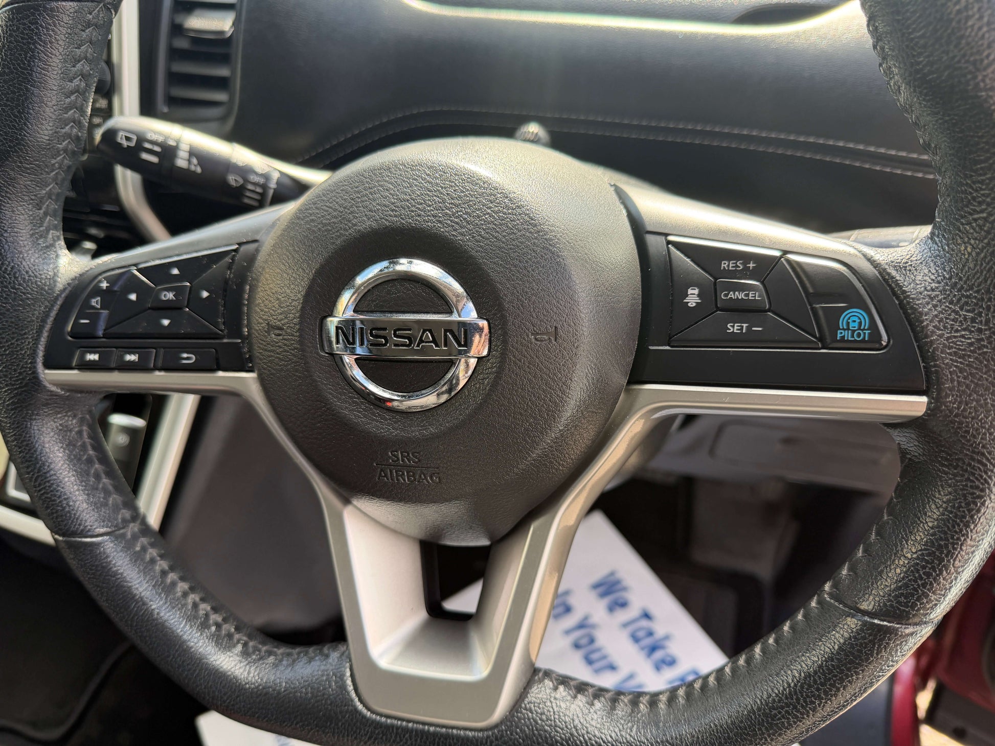 2016 Nissan Serena 2.0L S-Hybrid steering wheel controls and Nissan logo