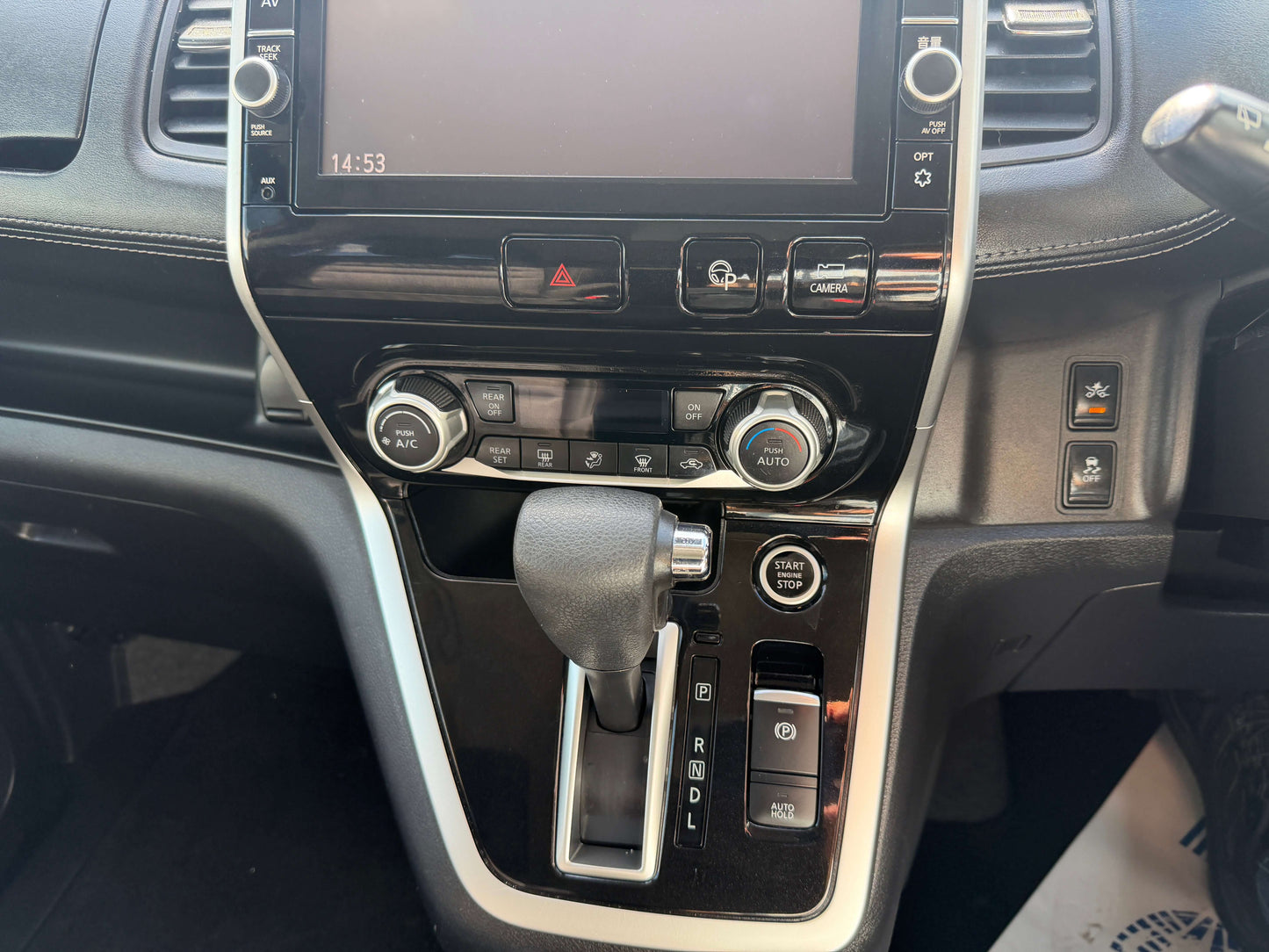 Interior view of 2016 Nissan Serena 2.0L S-Hybrid showing gear shift and dashboard controls.