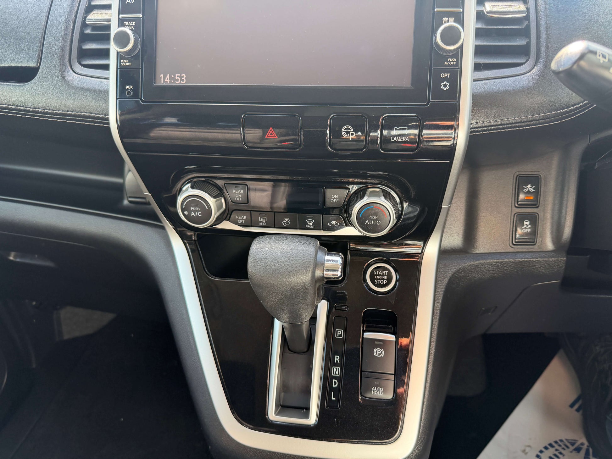 Interior view of 2016 Nissan Serena 2.0L S-Hybrid showing gear shift and dashboard controls.