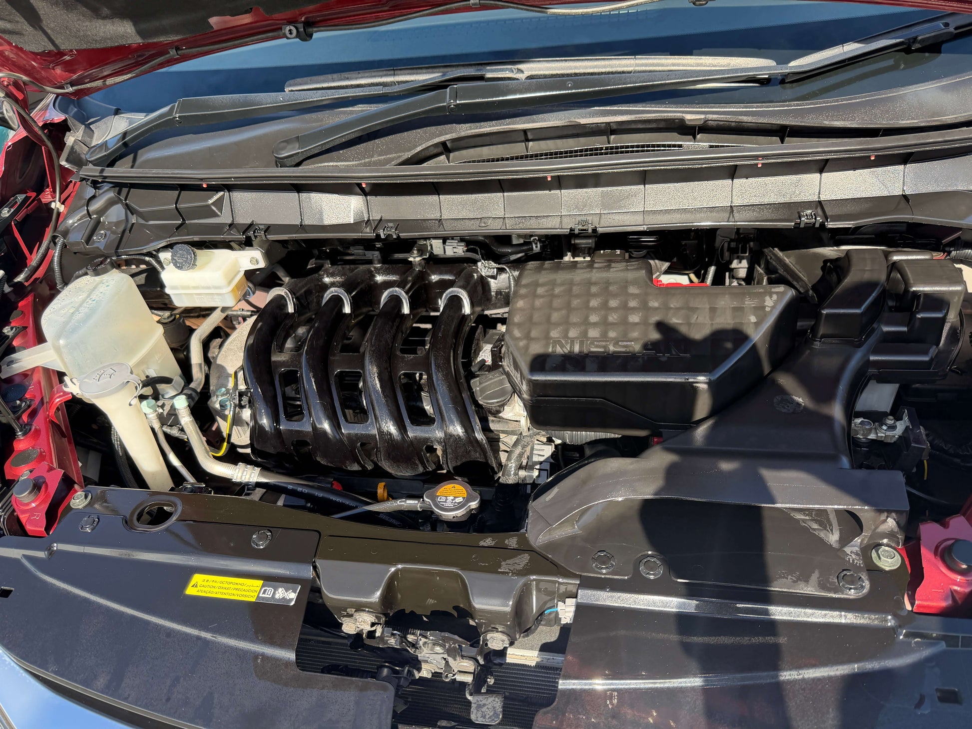 Engine bay of a 2016 Nissan Serena 2.0L S-Hybrid Highway Star showcasing the internal components.