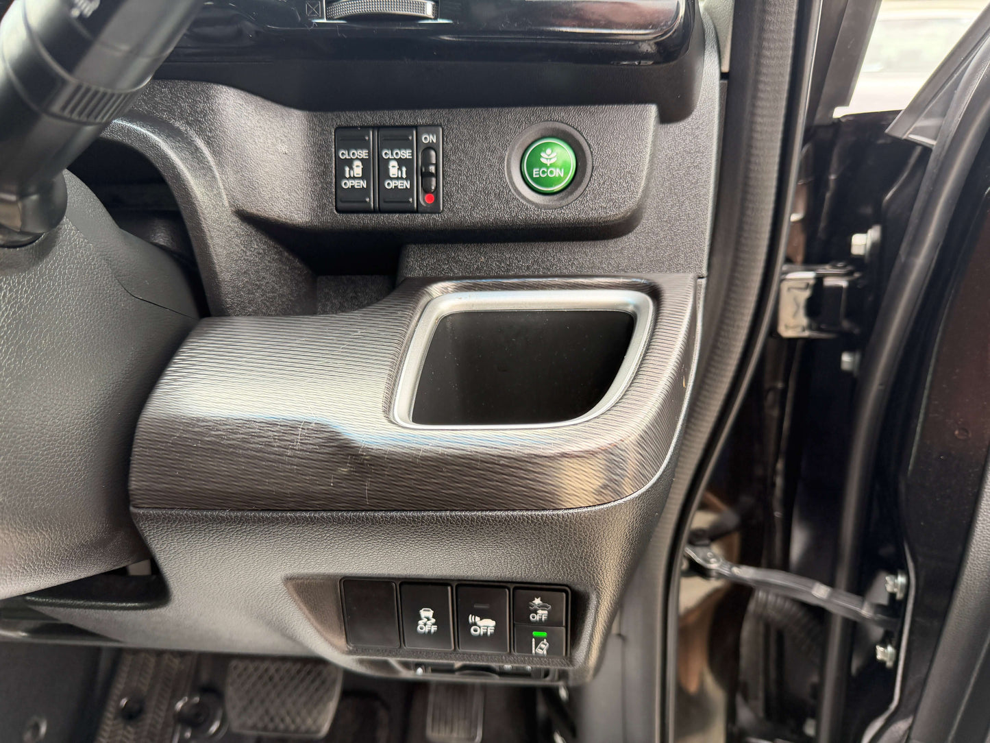 Interior controls of 2018 Honda Stepwgn 2.0 Spada Hybrid G, including ECON button and storage compartment.