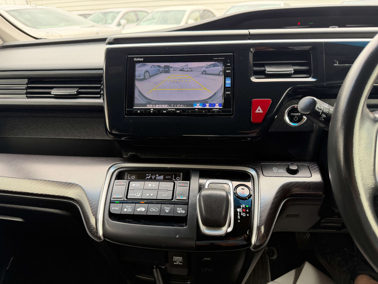 Interior view of 2018 Honda Stepwgn 2.0 Spada Hybrid G Honda Sensing featuring dashboard and reverse camera display.
