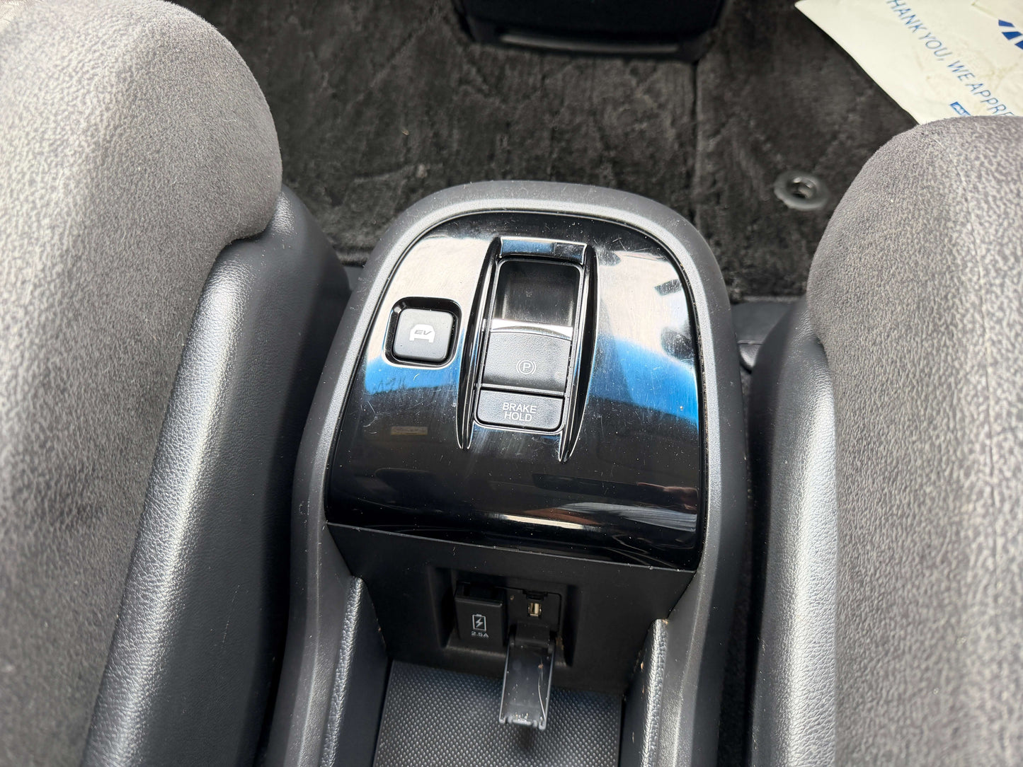 Interior view of 2018 Honda Stepwgn 2.0 Spada Hybrid G Honda Sensing with switch controls and center console.