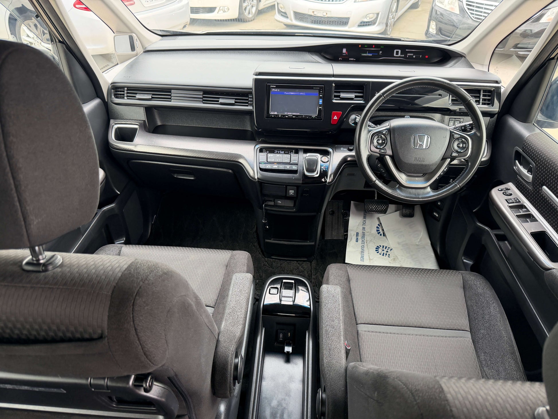 Interior view of the 2018 Honda Stepwgn 2.0 Spada Hybrid showcasing dashboard and seating.