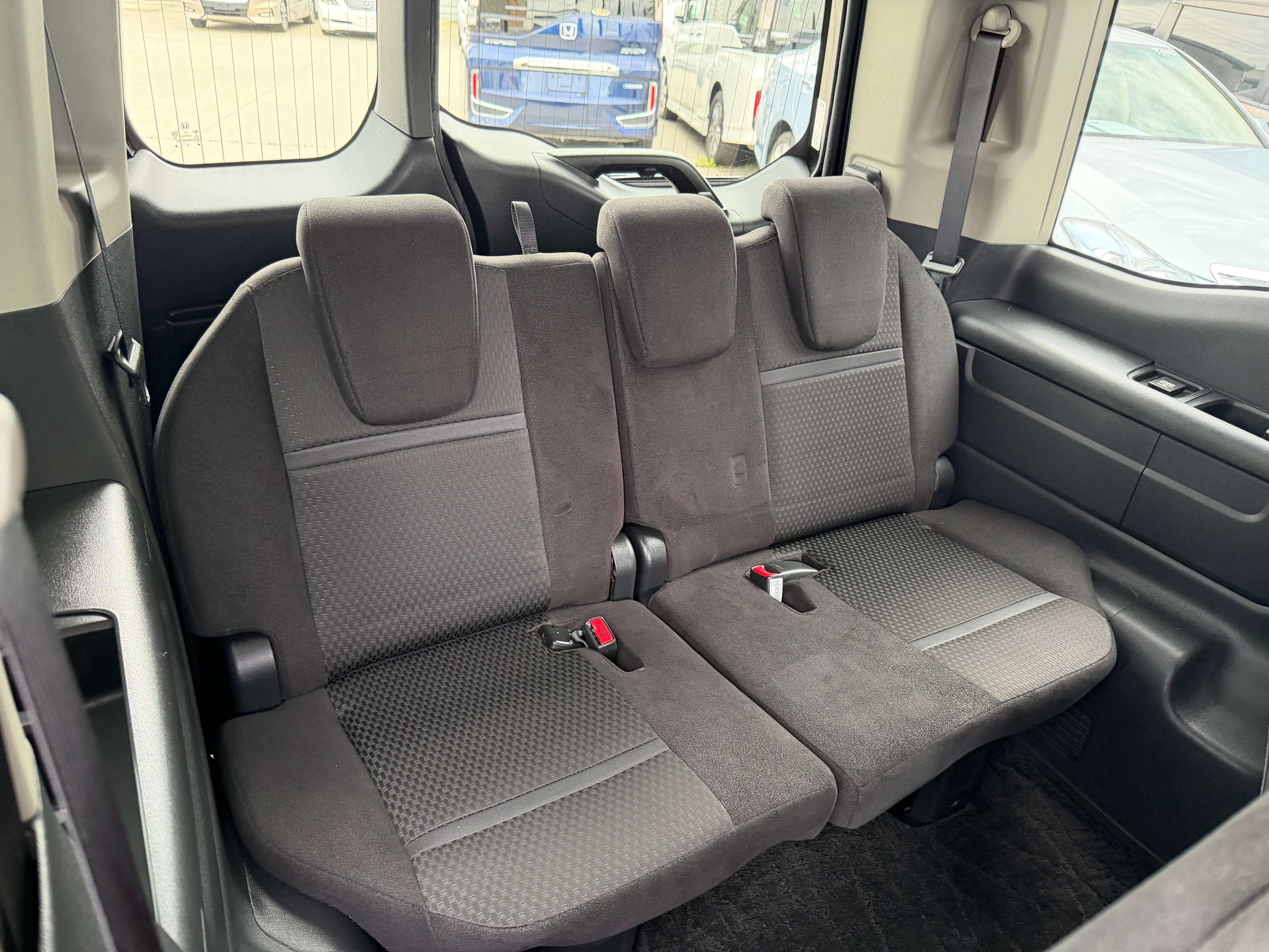 Interior view of 2018 Honda Stepwgn 2.0 Spada Hybrid G Honda Sensing showing the back seats with seat belts.
