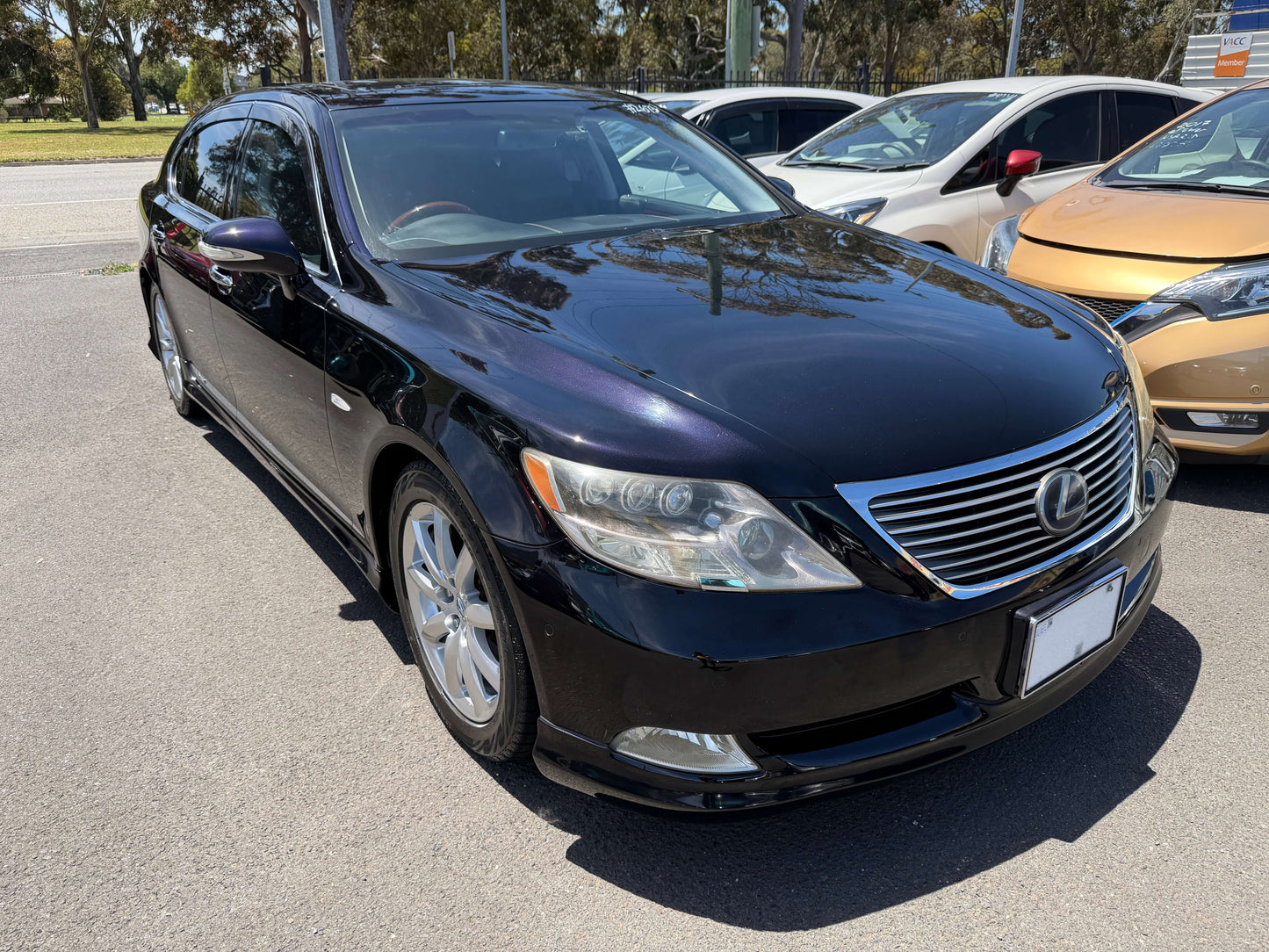 2007 Lexus LS600hL AWD V8 5.0L Hybrid luxury sedan parked outdoors, showcasing its sleek black exterior.