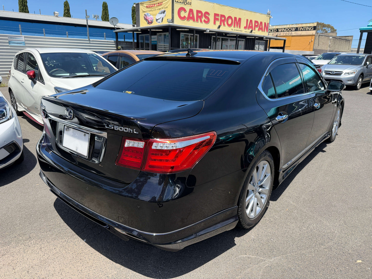 2007 Lexus LS600hL AWD V8 5.0L Hybrid Luxury Sedan rear view in black color with distinctive features