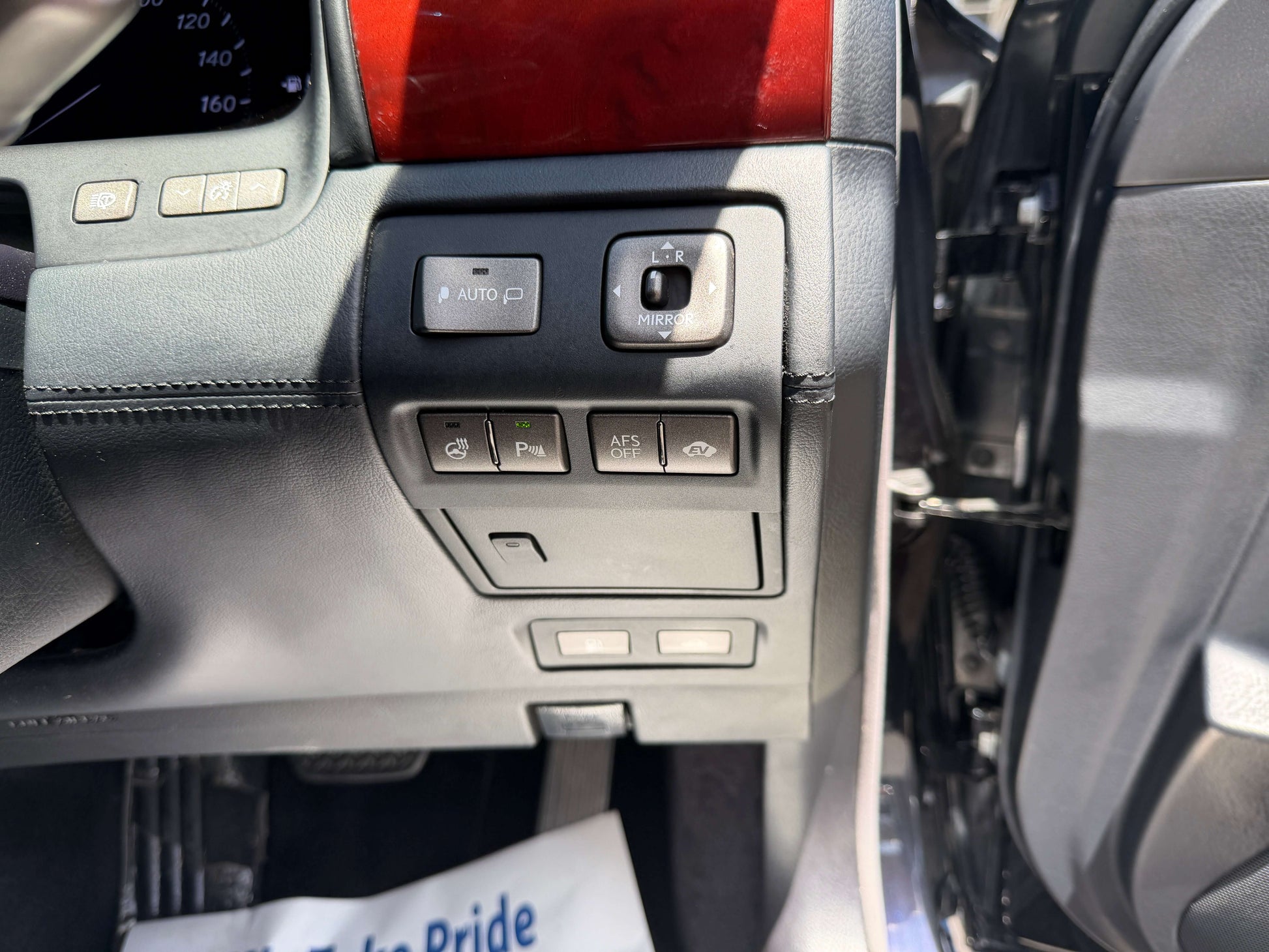 Interior controls of a 2007 Lexus LS600hL AWD V8 5.0L Hybrid Luxury Sedan, including seat and camera buttons.