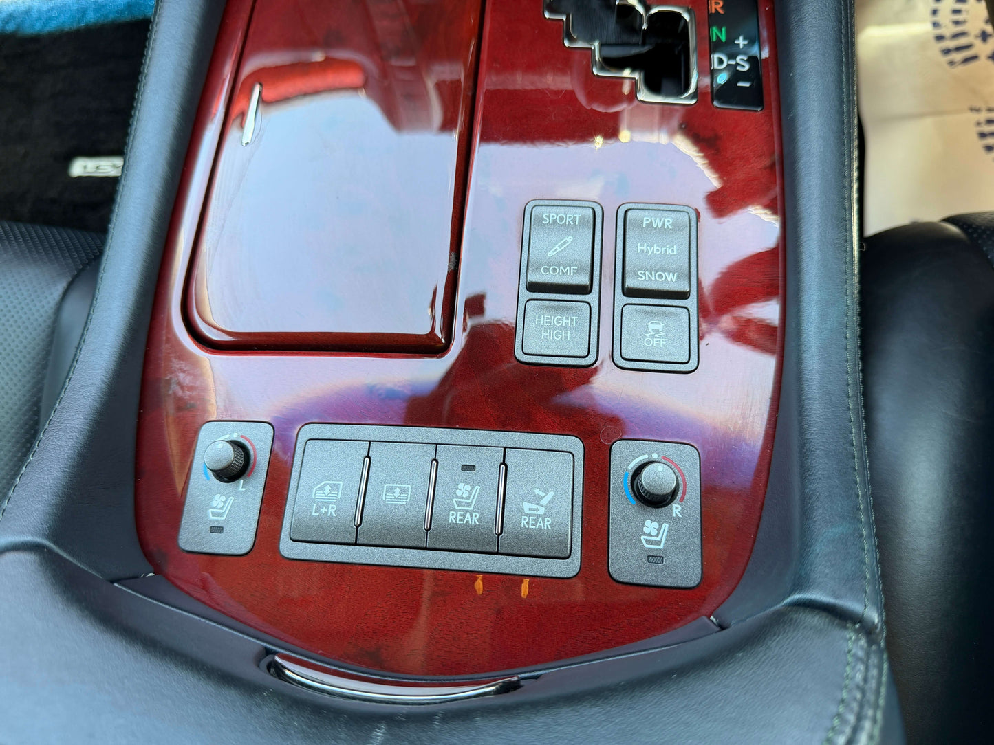 2007 Lexus LS600hL AWD V8 5.0L Hybrid luxury sedan center console with control buttons and wood trim