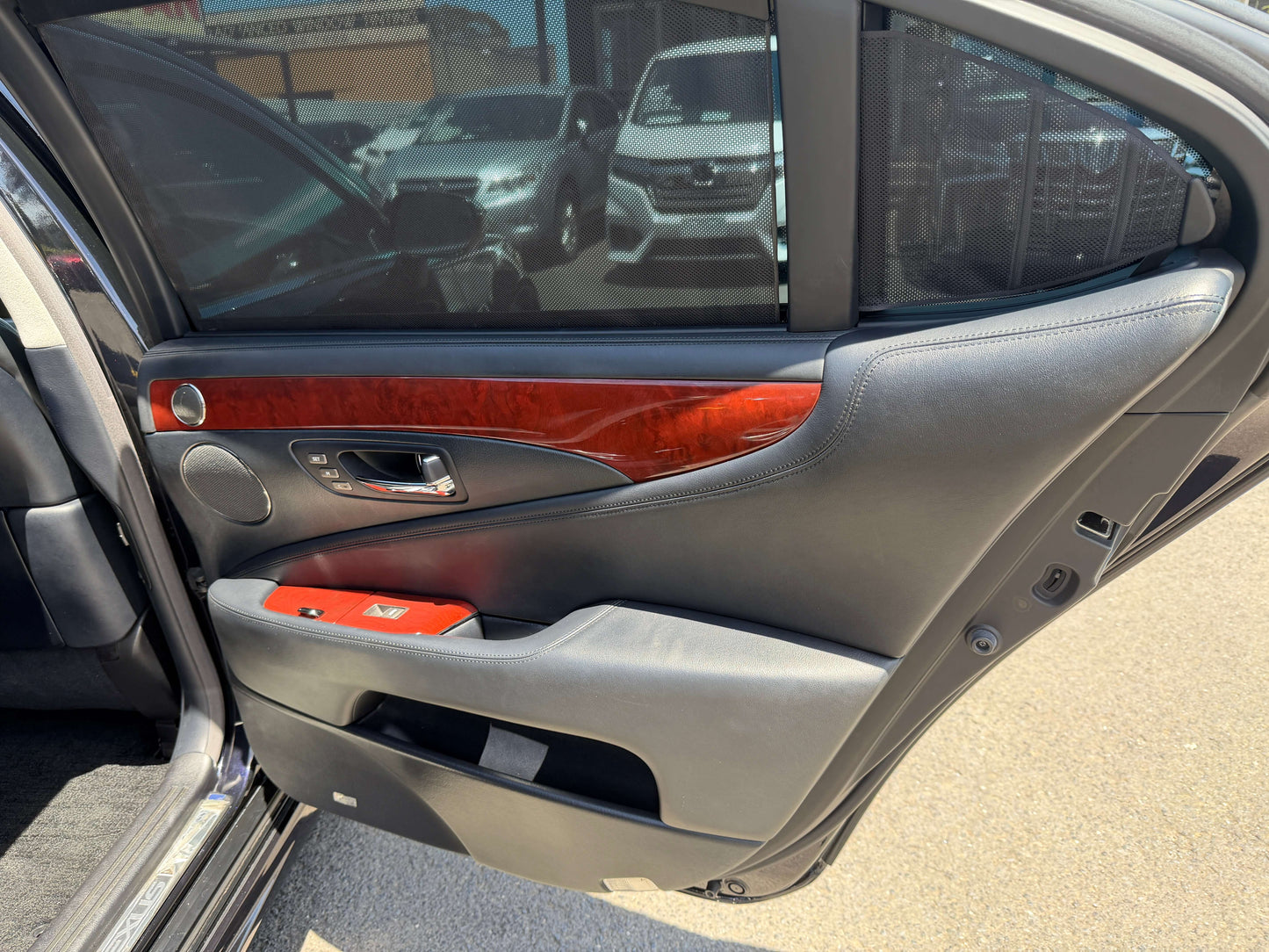 Interior door panel of a 2007 Lexus LS600hL AWD V8 5.0L Hybrid Luxury Sedan featuring wood trim.