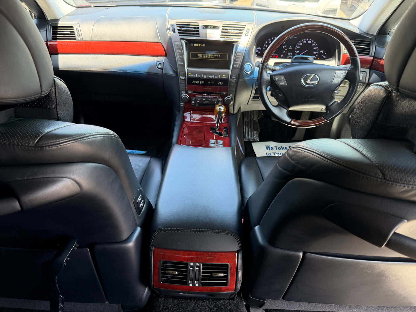 Interior view of 2007 Lexus LS600hL AWD V8 5.0L Hybrid Luxury Sedan with leather seats and elegant dashboard.