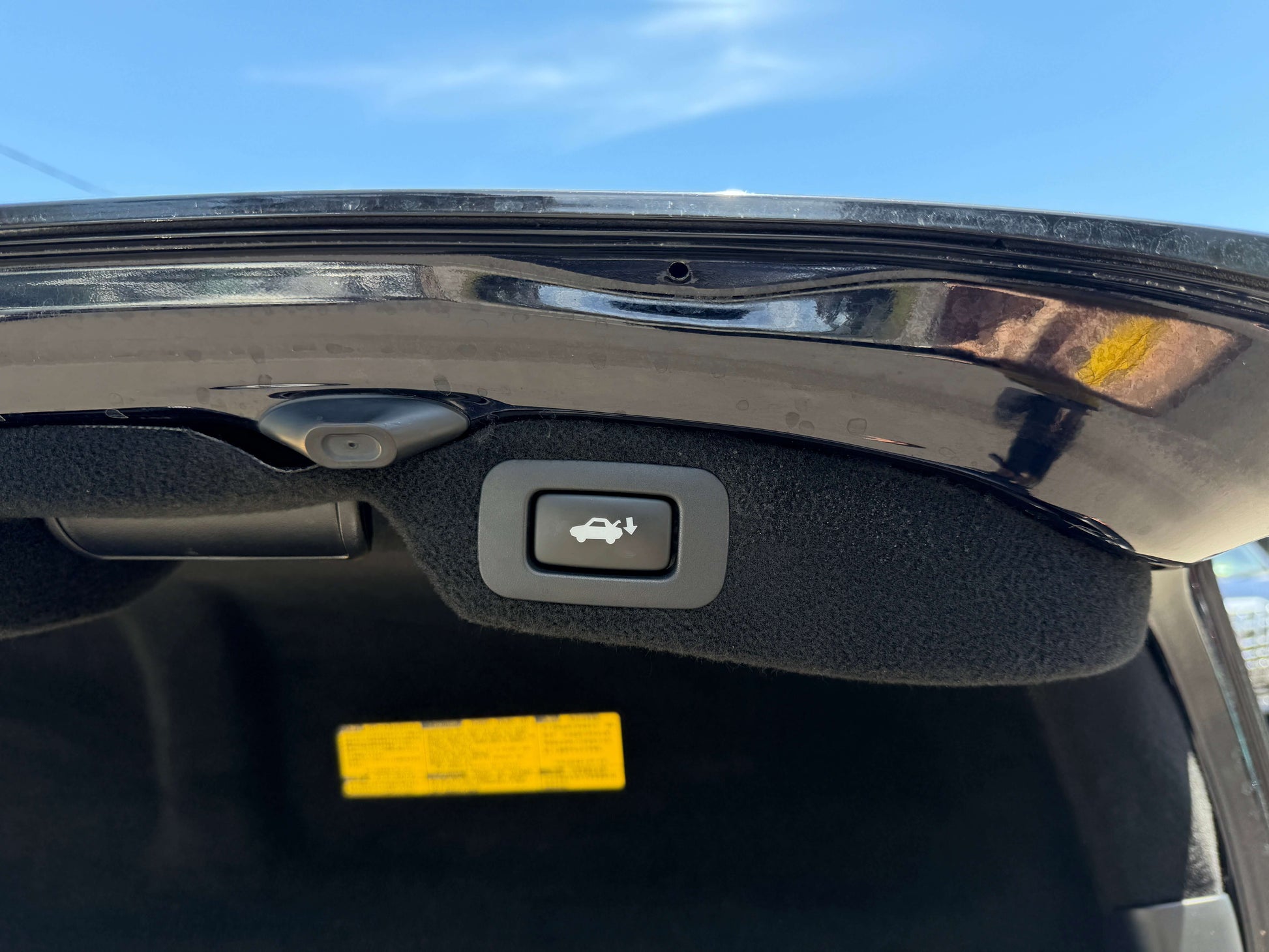 Trunk release button inside a 2007 Lexus LS600hL AWD V8 5.0L Hybrid luxury sedan.