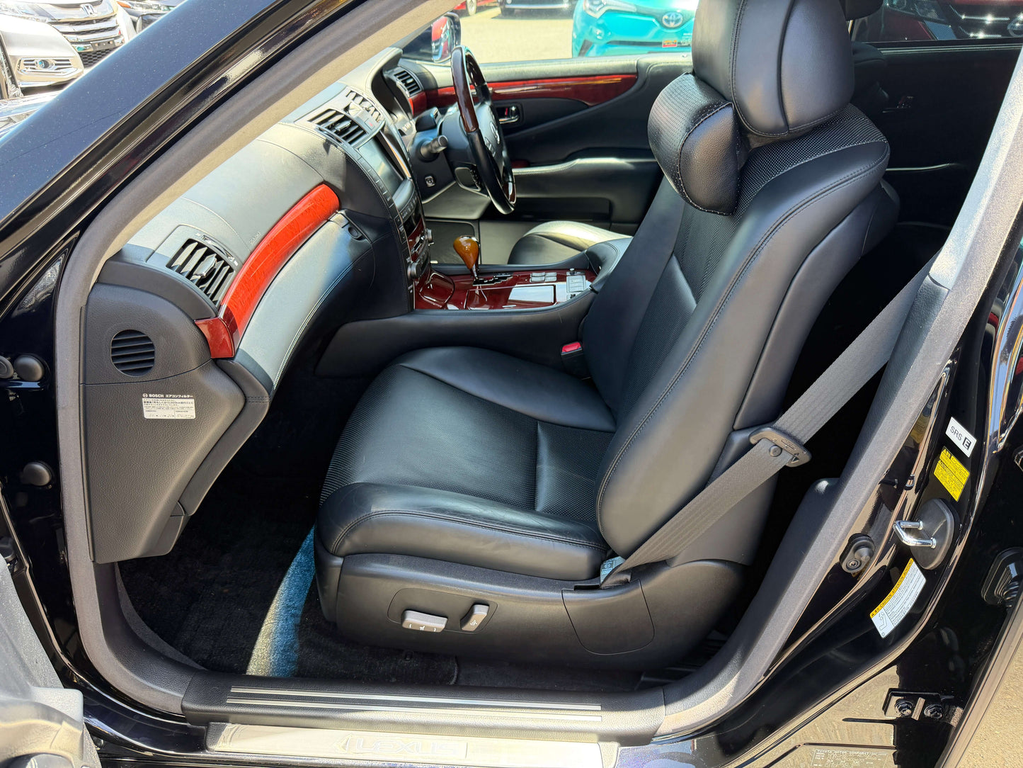 2007 Lexus LS600hL AWD V8 5.0L Hybrid luxury sedan interior view with black leather seats.