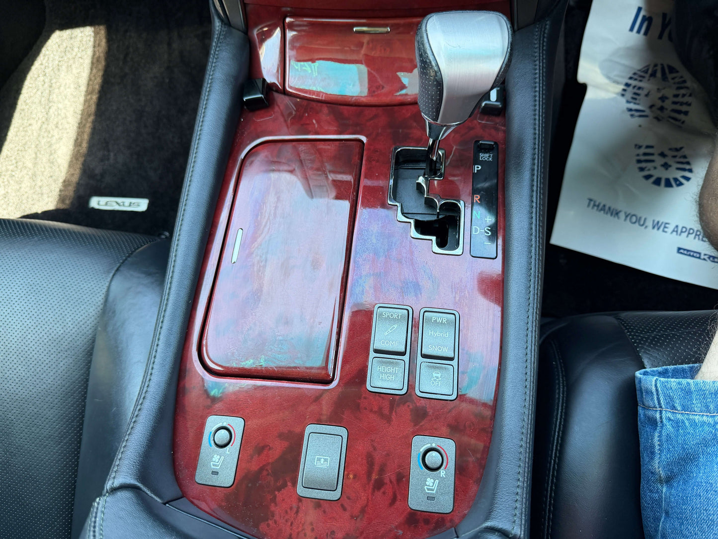 Interior view of the 2007 Lexus LS600h AWD V8 5.0L Hybrid luxury sedan center console with gear shift and controls