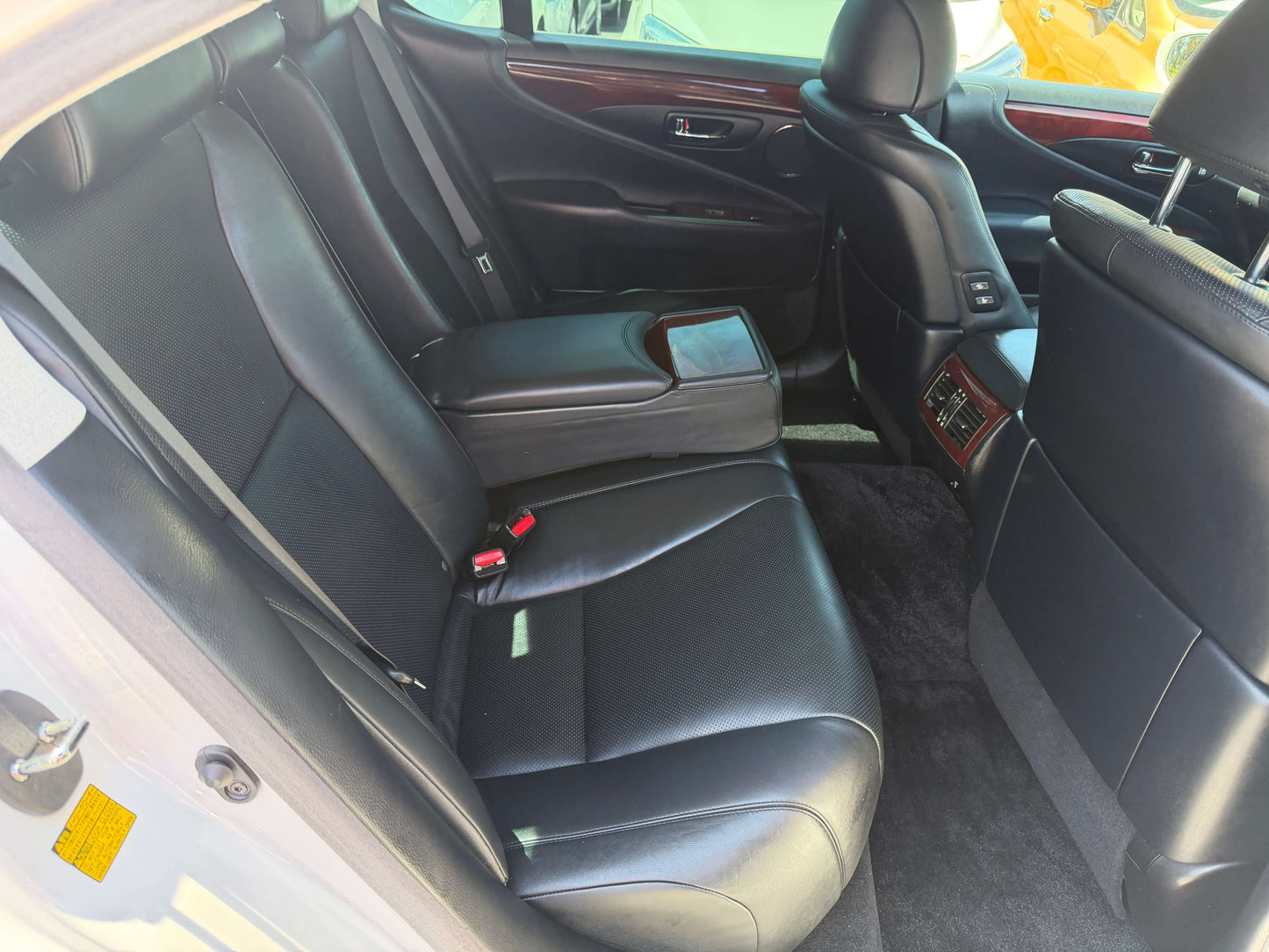 Interior view of the back seats in a 2007 Lexus LS600h AWD V8 5.0L Hybrid luxury sedan.