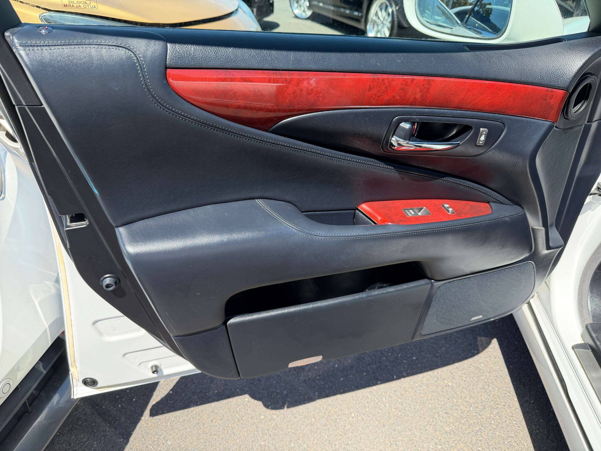 2007 Lexus LS600h AWD V8 5.0L Hybrid luxury sedan interior door panel with wood and leather finishes.