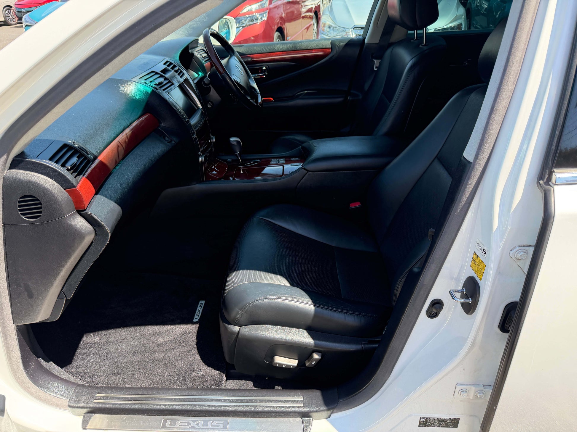 Interior view of 2007 Lexus LS600h AWD V8 5.0L Hybrid showing luxurious black leather seats and dashboard.