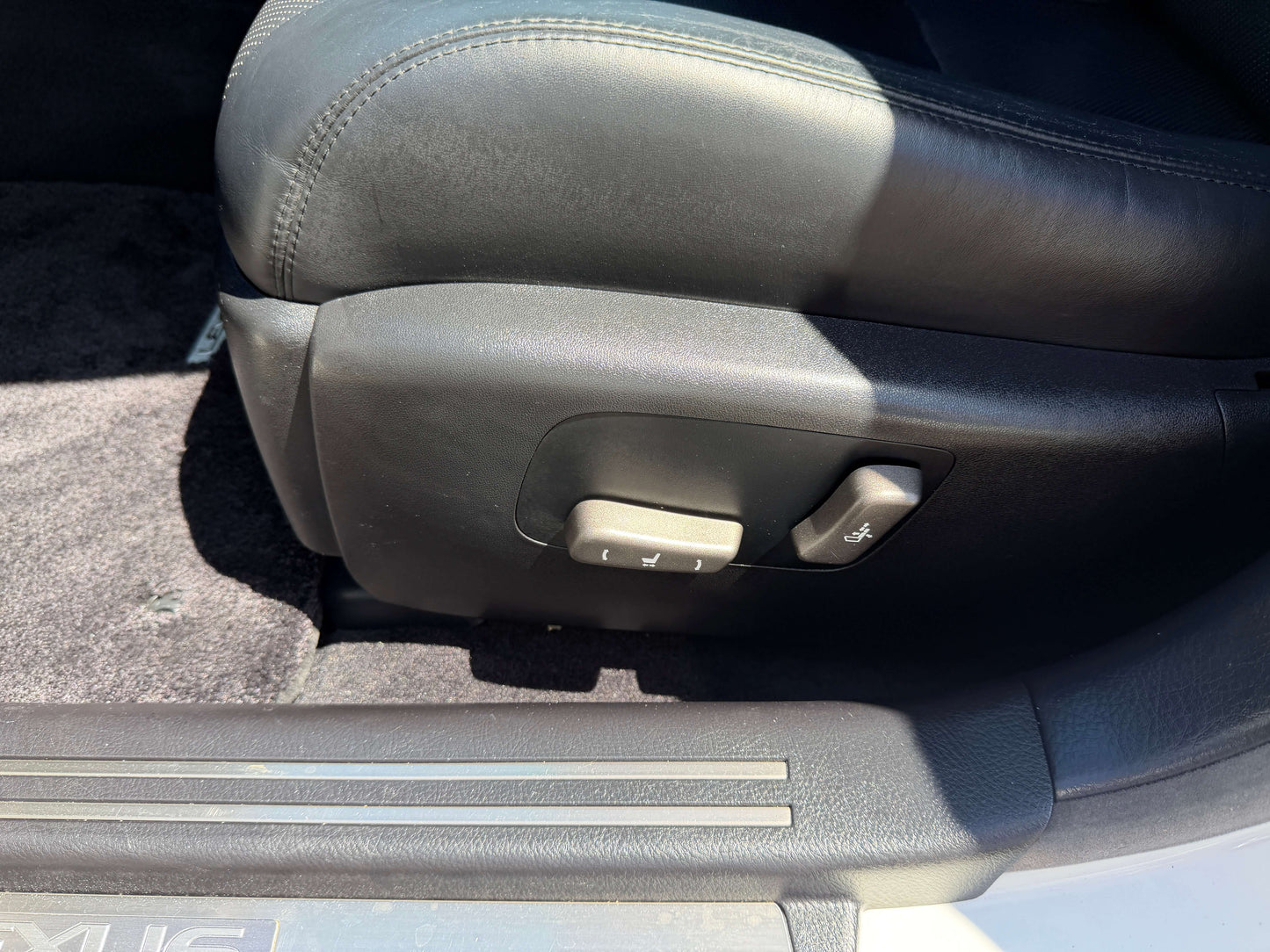 Interior view of 2007 Lexus LS600h AWD V8 5.0L Hybrid seat adjustment controls.