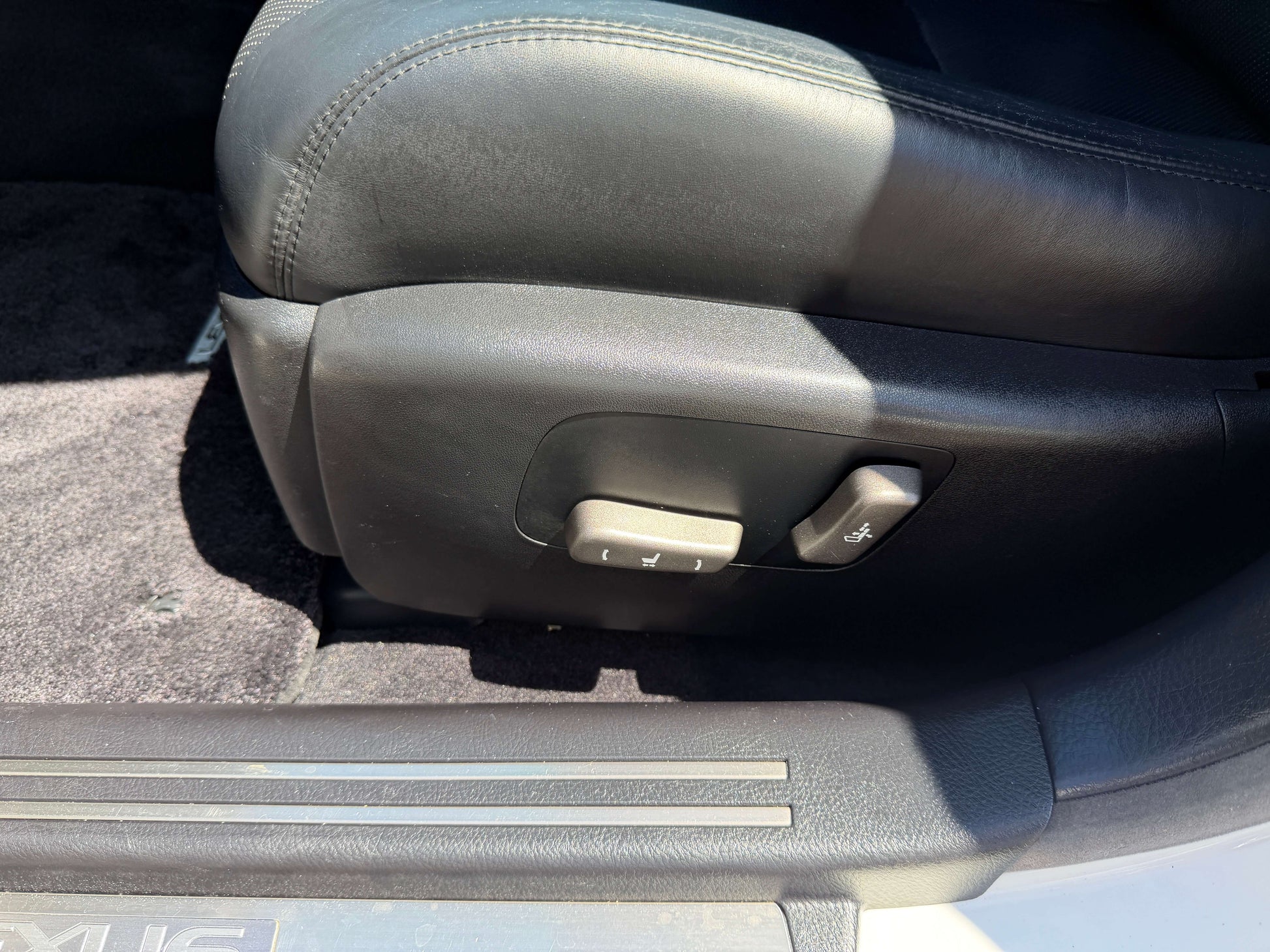 Interior view of 2007 Lexus LS600h AWD V8 5.0L Hybrid seat adjustment controls.