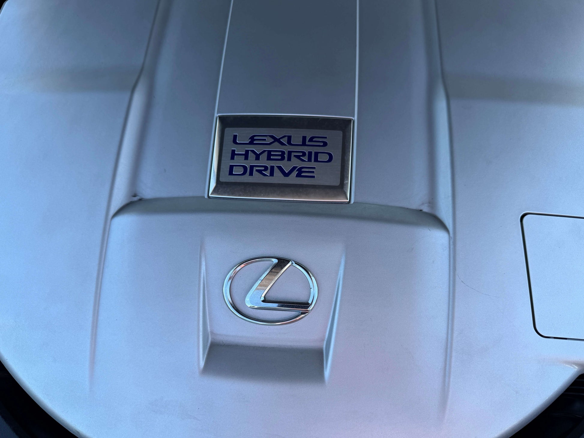 Engine cover of 2007 Lexus LS600h AWD V8 5.0L Hybrid showcasing Lexus Hybrid Drive technology.
