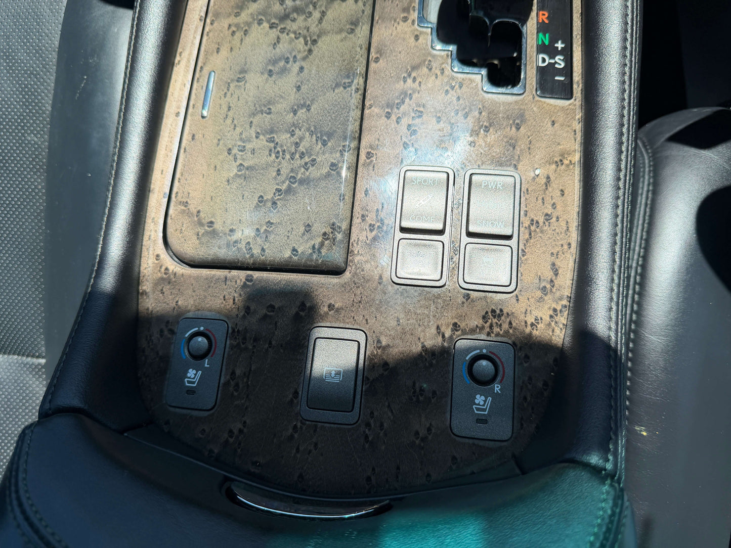 2007 Lexus LS600h AWD V8 5.0L Hybrid interior console with buttons for heated seats and gear shift.