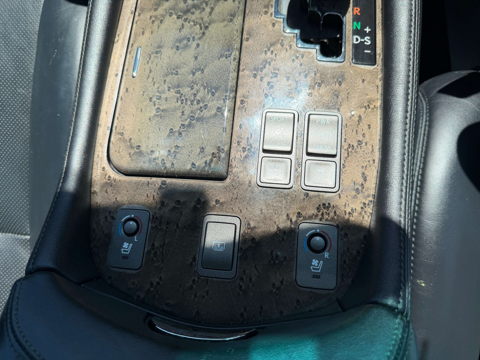 2007 Lexus LS600h AWD V8 5.0L Hybrid interior console with buttons for heated seats and gear shift.