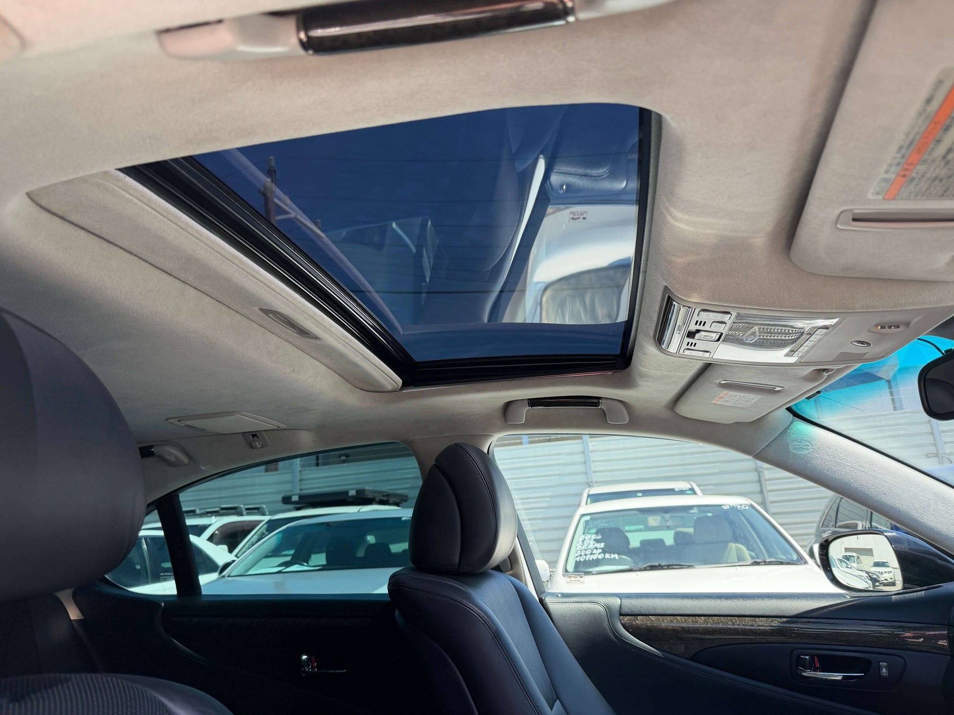 Interior view of a 2007 Lexus LS600h AWD V8 5.0L Hybrid showcasing the sunroof and luxury seating.