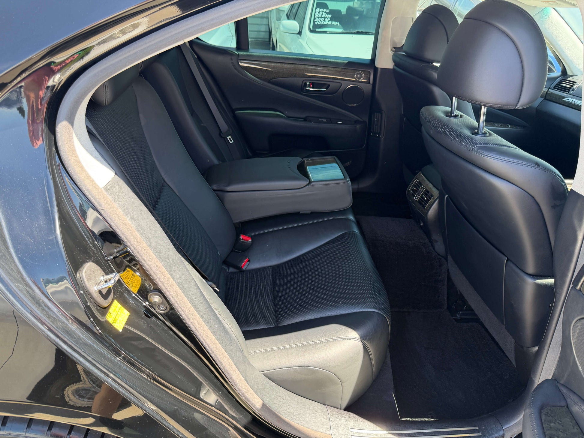 Interior view of the rear seating area in a 2007 Lexus LS600h AWD V8 5.0L Hybrid luxury sedan.