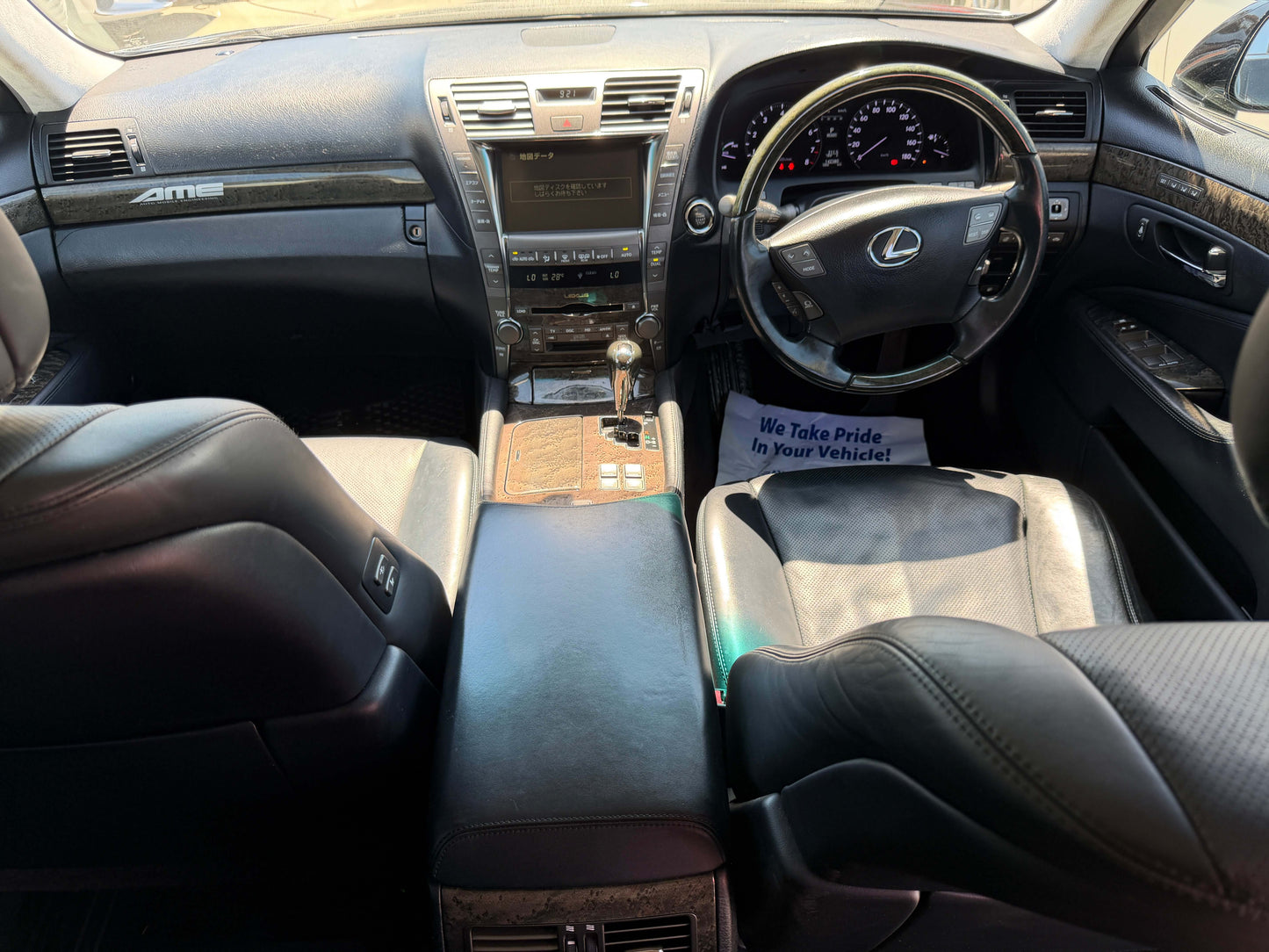 Interior view of a 2007 Lexus LS600h AWD V8 5.0L Hybrid luxury sedan showing stylish black leather seats.