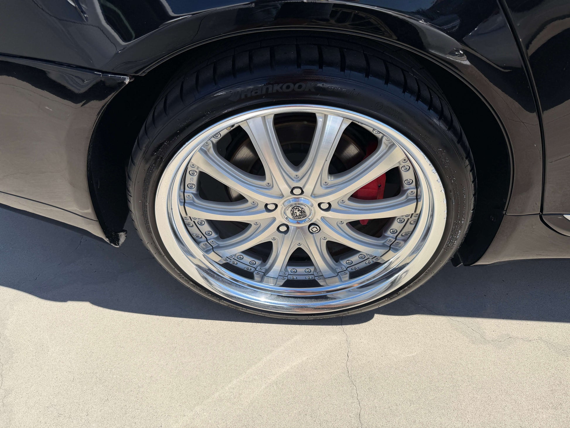 2007 Lexus LS600h AWD V8 5.0L Hybrid luxury sedan wheel close-up with chrome rims and performance tire.