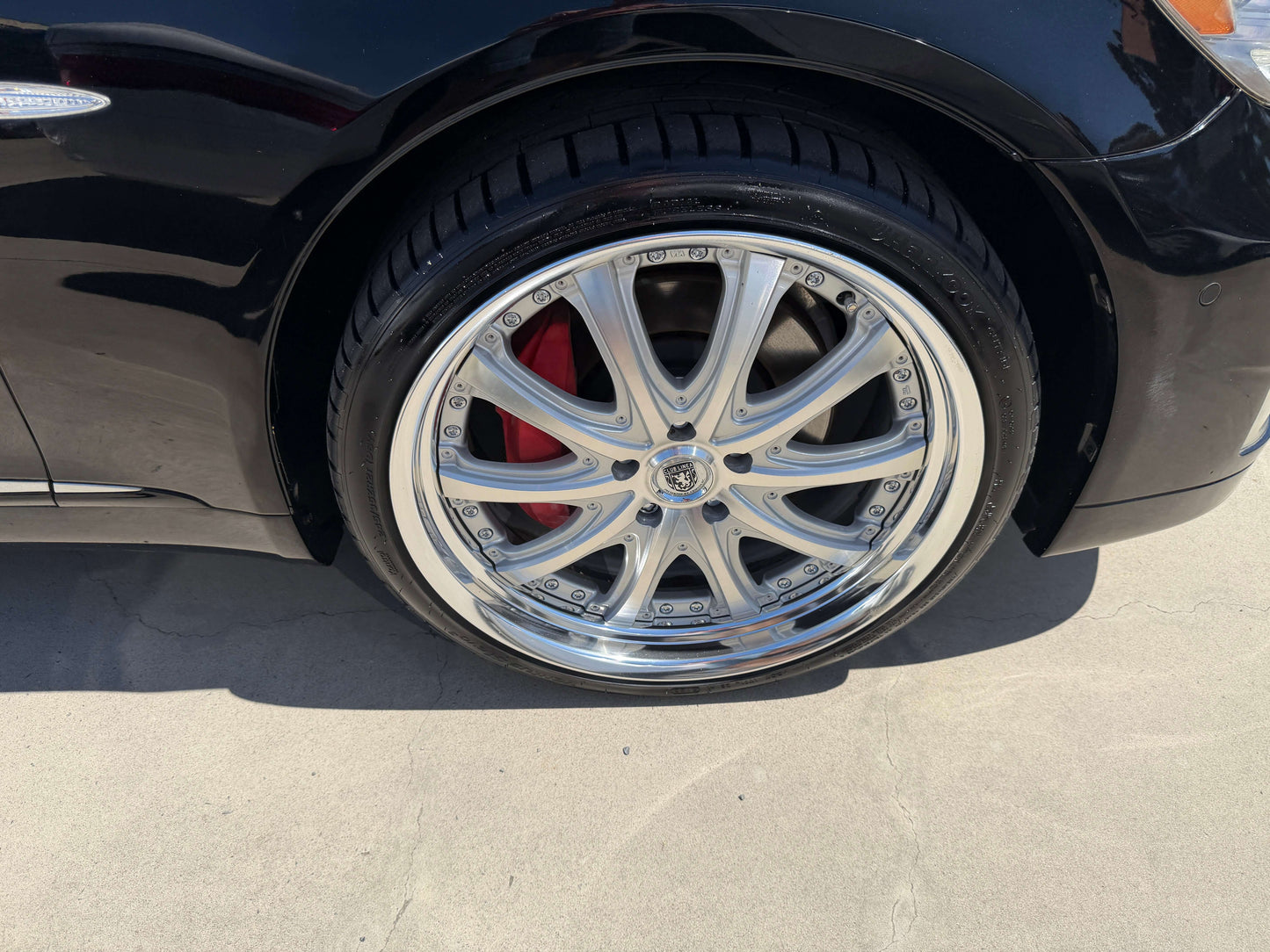 2007 Lexus LS600h AWD V8 5.0L Hybrid luxury sedan with chrome wheels and red brake calipers.