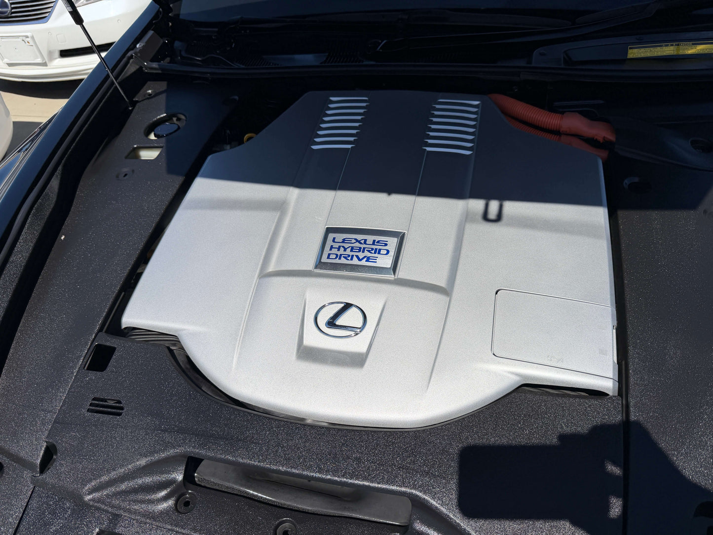 Image of the engine cover of a 2007 Lexus LS600h AWD V8 5.0L Hybrid showcasing the hybrid drive system.