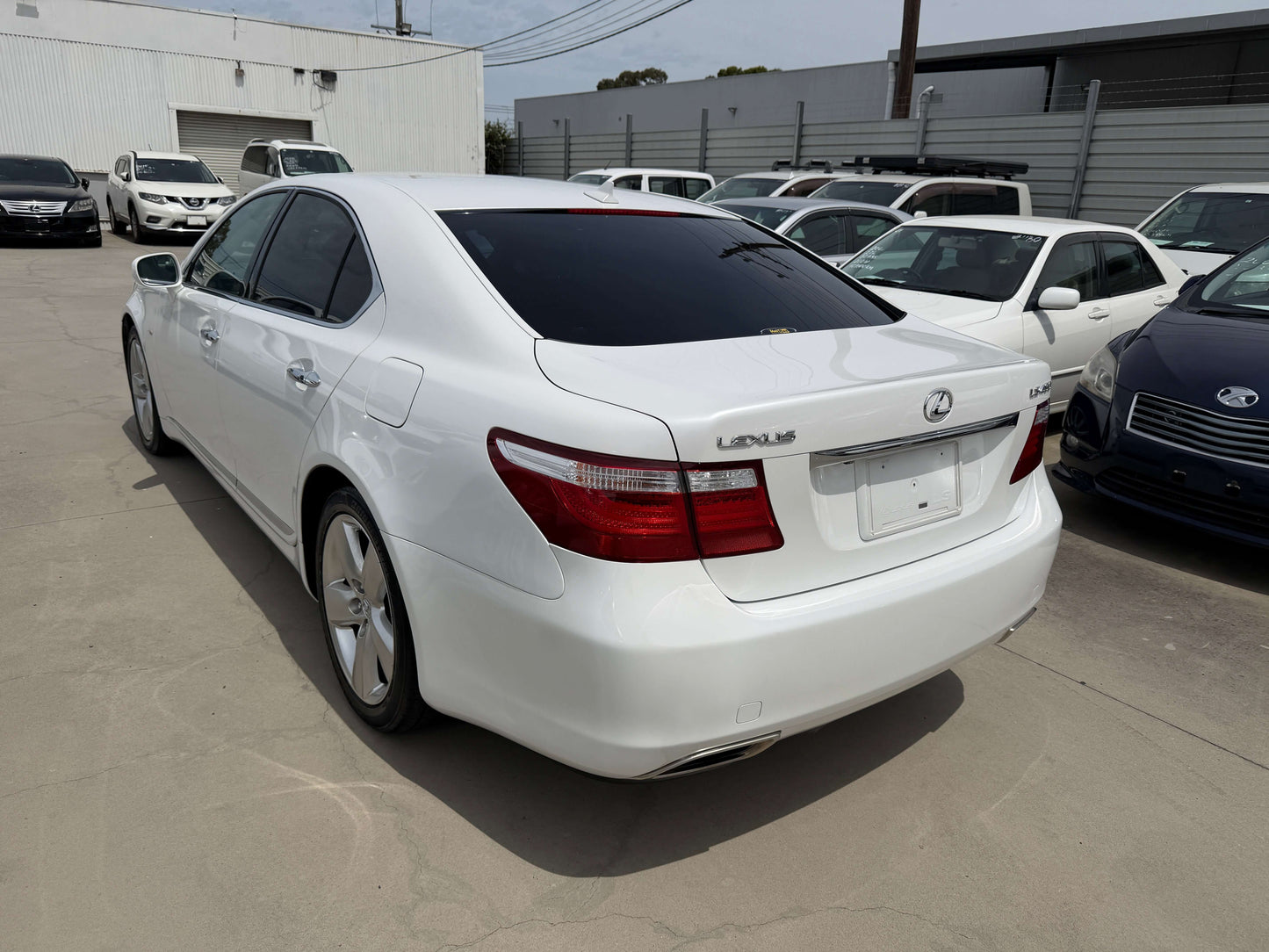 2007 Lexus LS460 V8 4.6L Version S I Package luxury sedan parked with other vehicles in background.