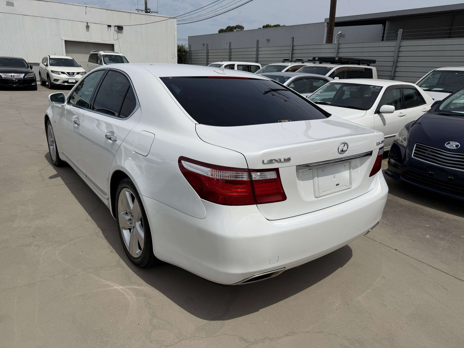 2007 Lexus LS460 V8 4.6L Version S I Package luxury sedan parked with other vehicles in background.