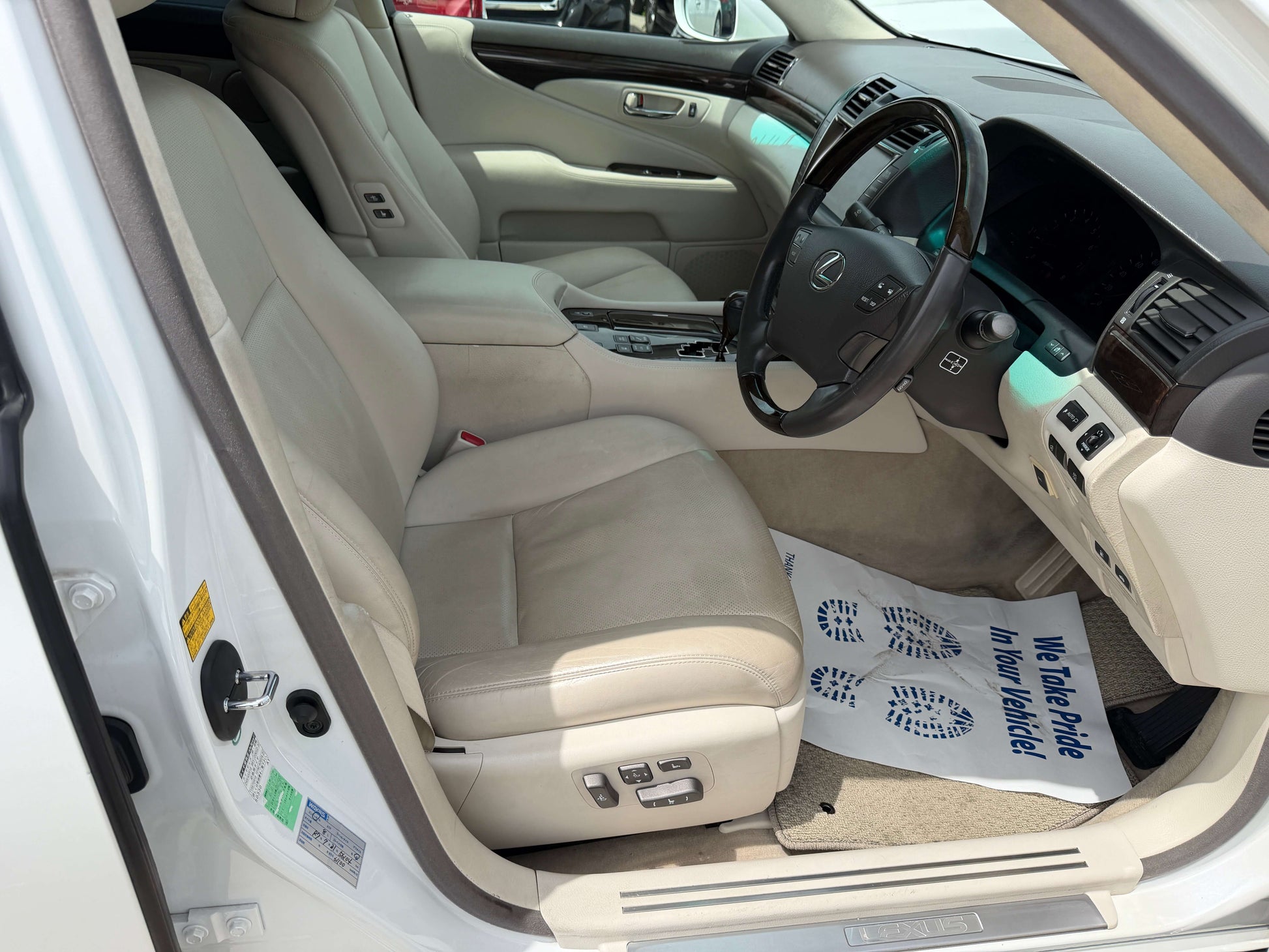 Interior view of a 2007 Lexus LS460 V8 4.6L showing premium leather seats and dashboard features.