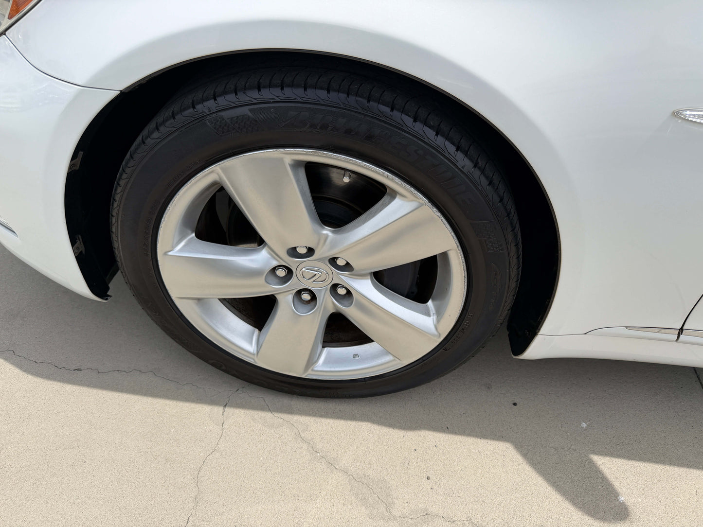 2007 Lexus LS460 V8 4.6L tire and wheel close-up showcasing luxury sedan features.