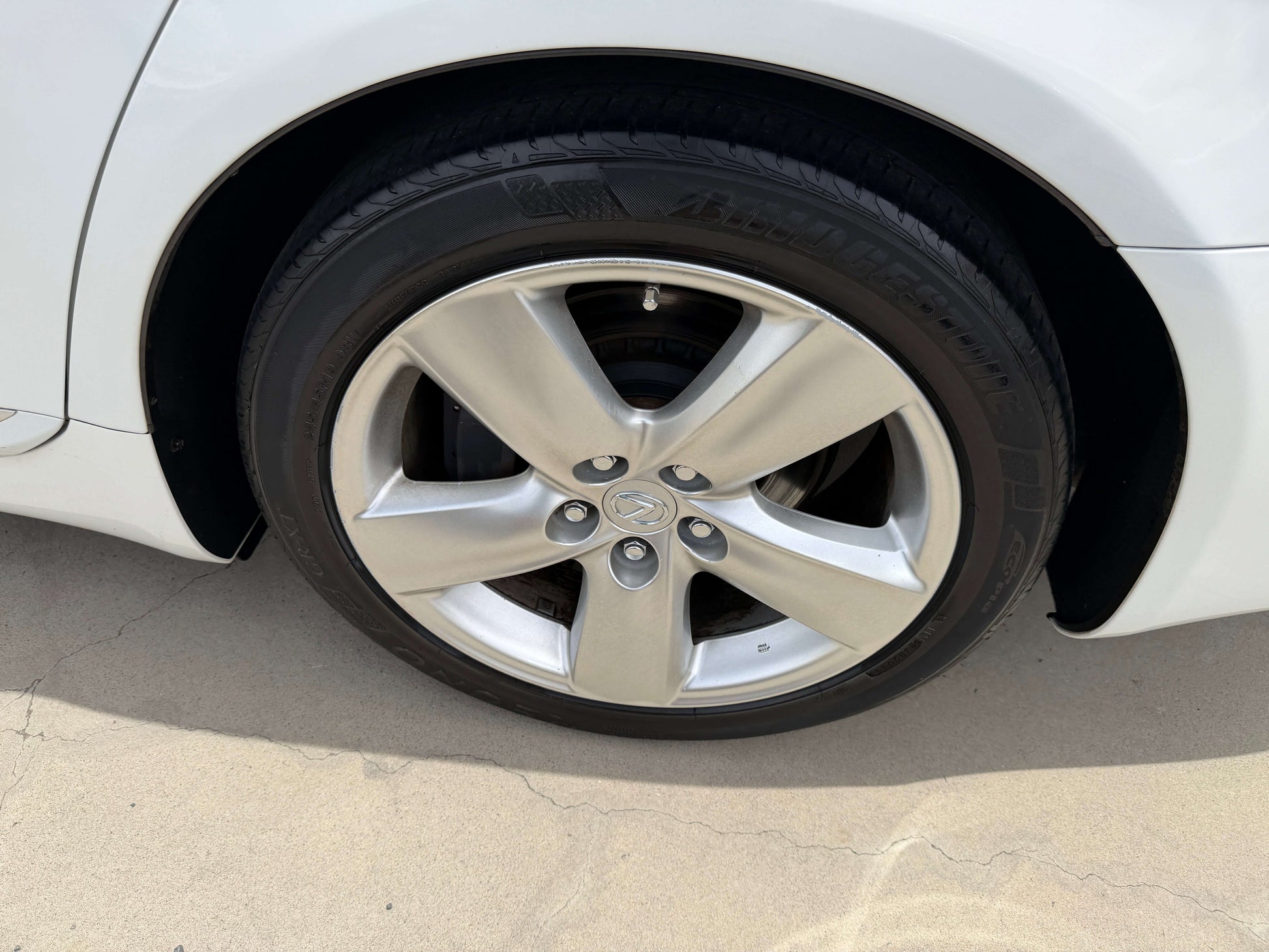 2007 Lexus LS460 V8 4.6L wheel close-up showcasing premium alloy rim design for luxury sedan