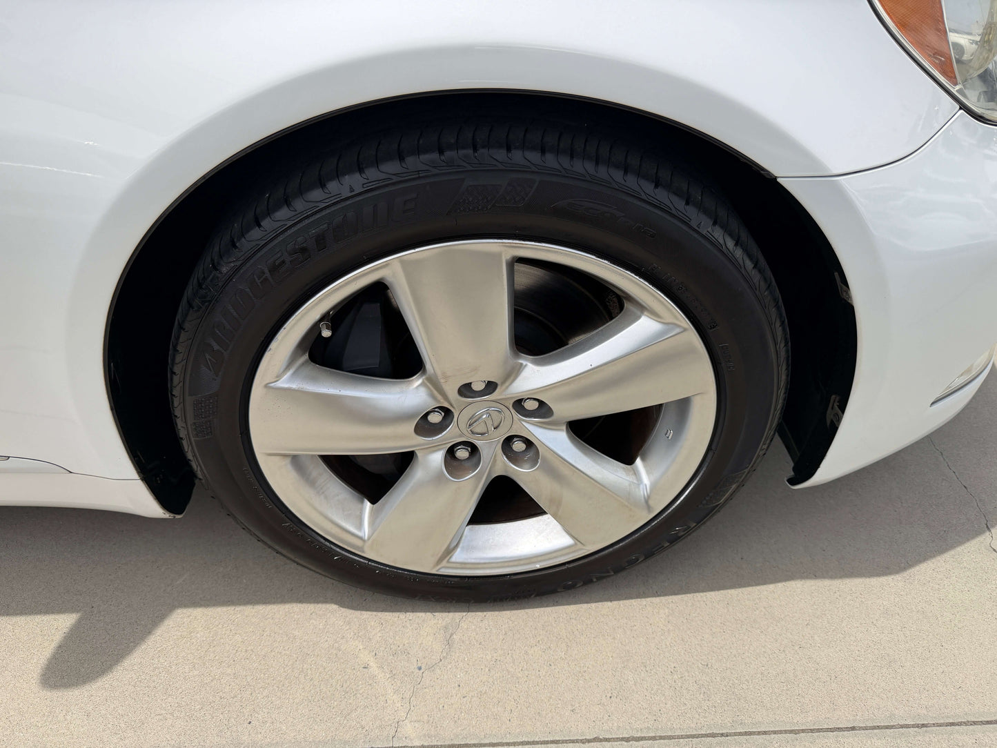 Close-up of the wheel and tire of a 2007 Lexus LS460 V8 4.6L Version S I Package Luxury Sedan.