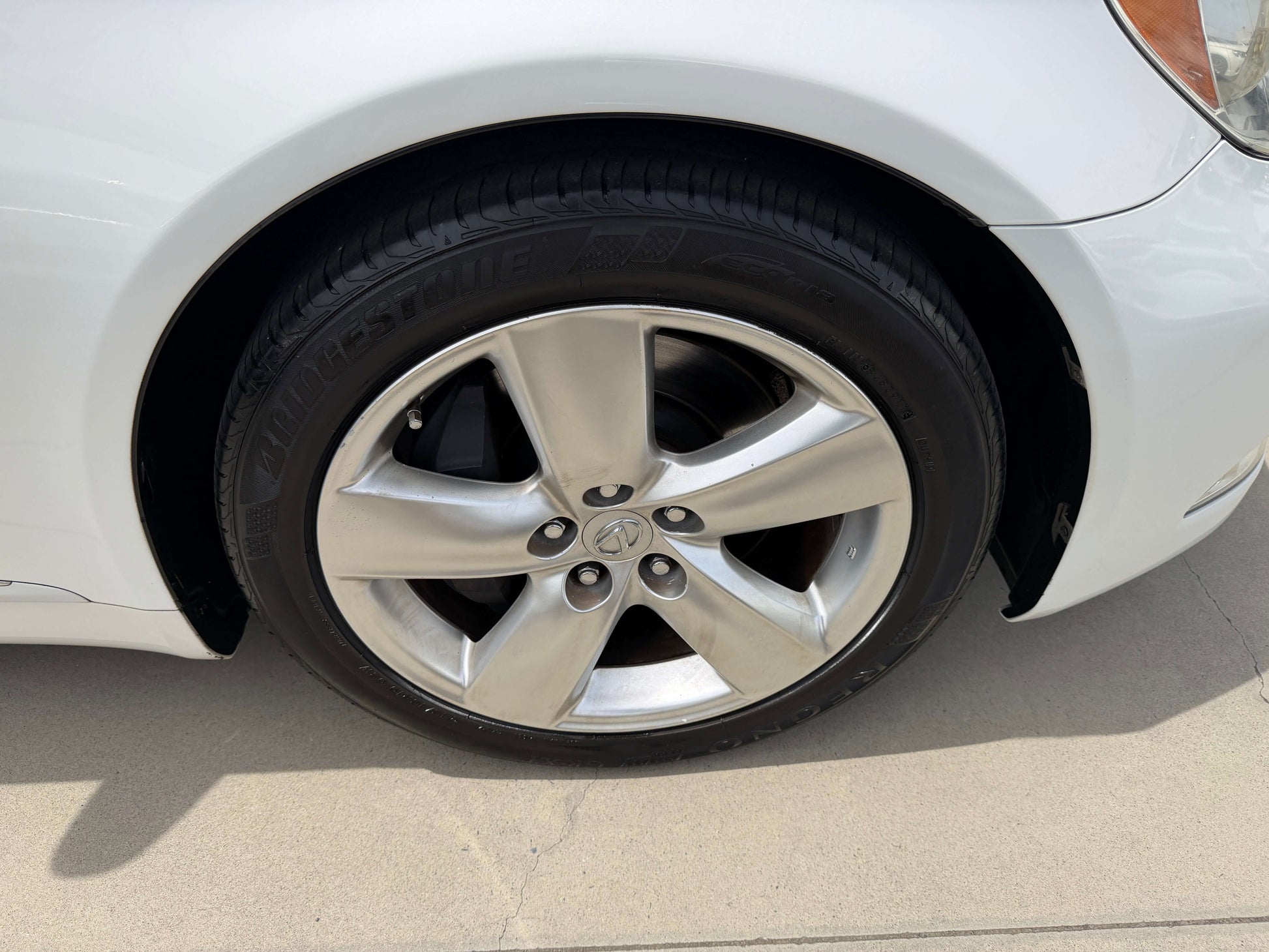 Close-up of the wheel and tire of a 2007 Lexus LS460 V8 4.6L Version S I Package Luxury Sedan.