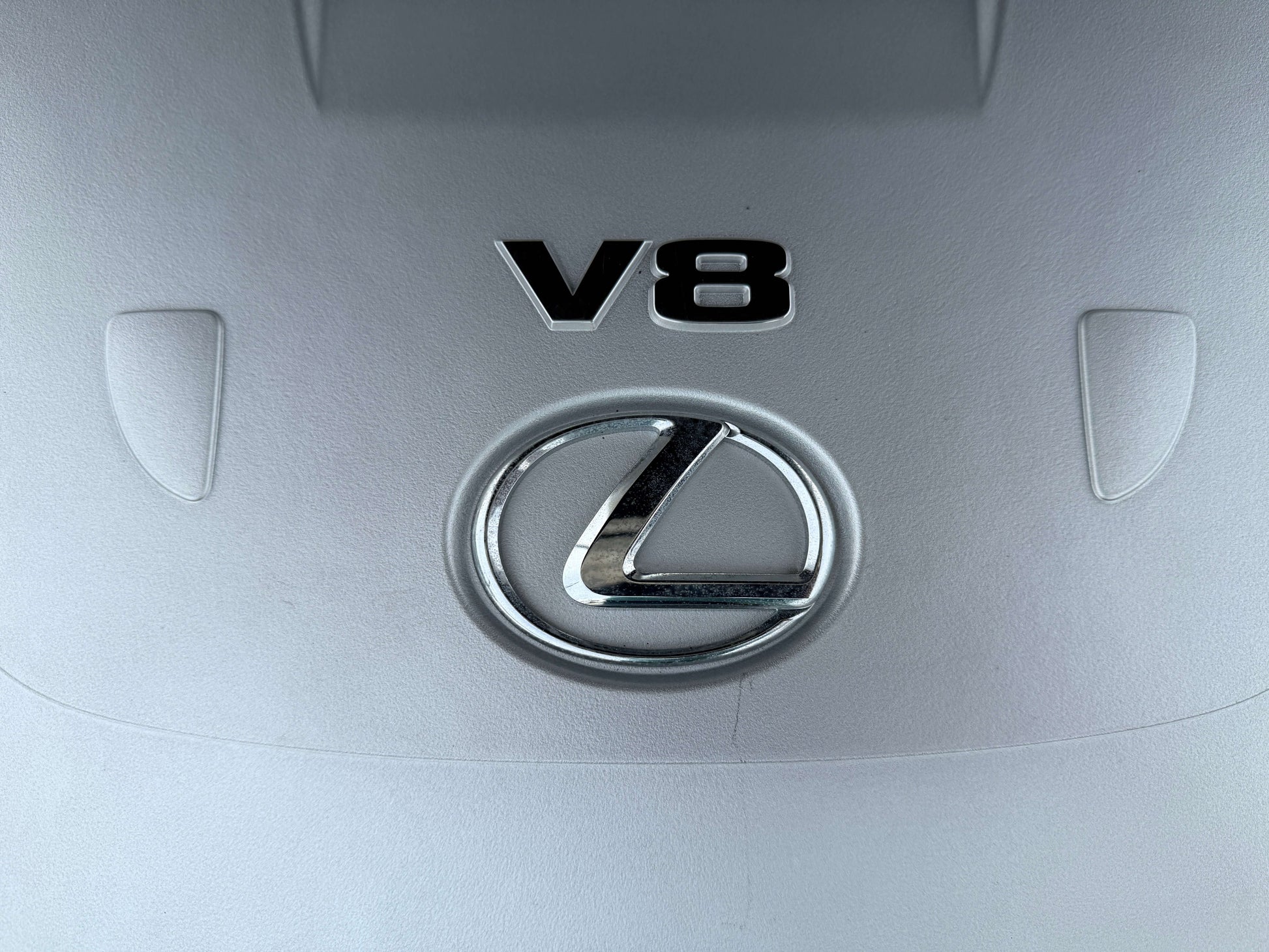 2007 Lexus LS460 V8 4.6L engine cover with V8 badge and Lexus logo.