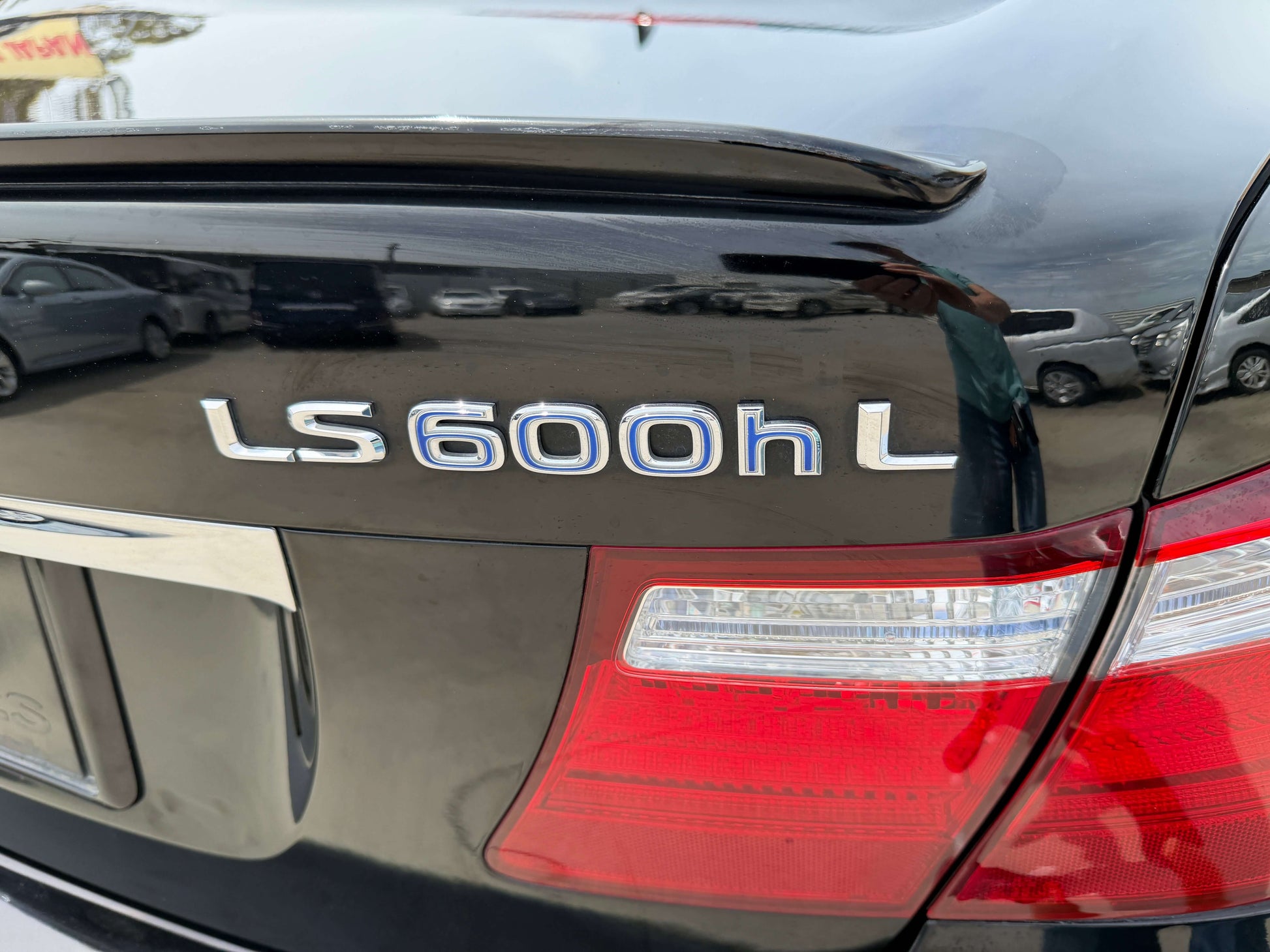 Close-up of the rear badge of a 2007 Lexus LS600hL AWD V8 5.0L Hybrid luxury sedan.