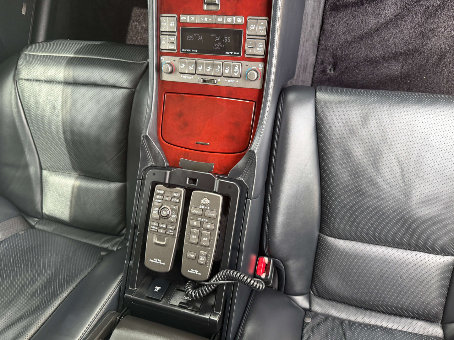 Interior view of 2007 Lexus LS600hL AWD V8 5.0L Hybrid showing luxury rear seat control features.