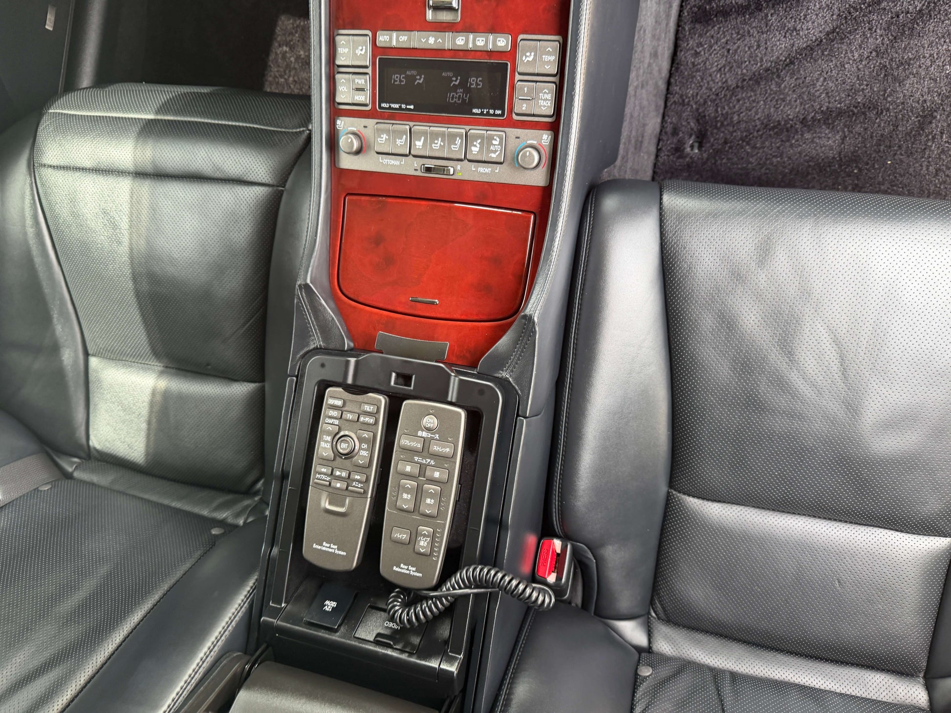 Interior view of 2007 Lexus LS600hL AWD V8 5.0L Hybrid showing luxury rear seat control features.