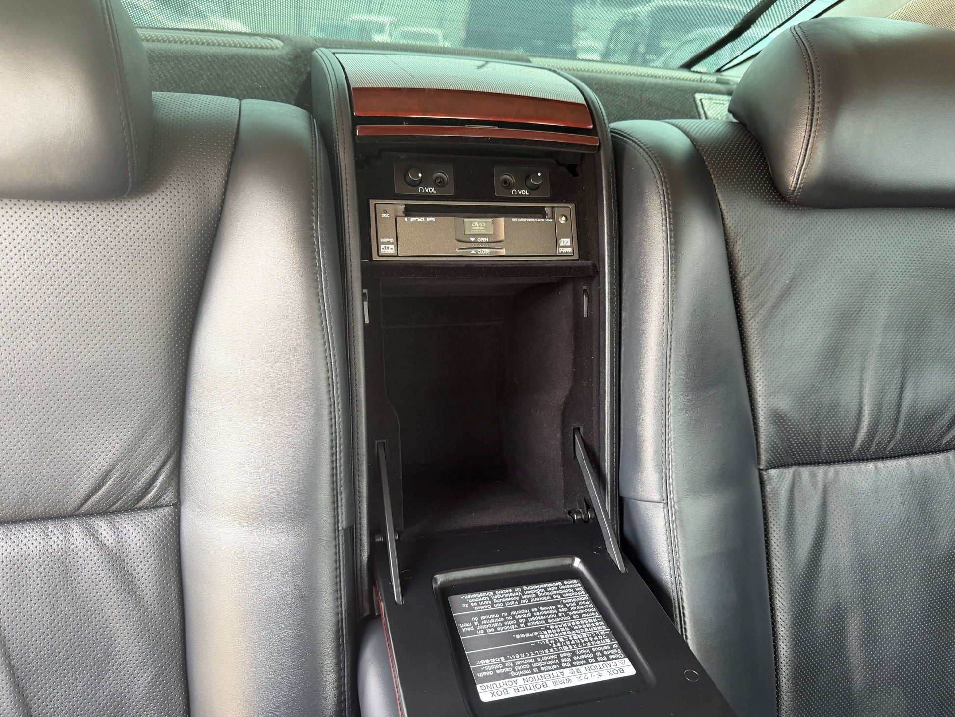 Luxury interior of 2007 Lexus LS600hL AWD V8 5.0L Hybrid showing rear seat amenities.