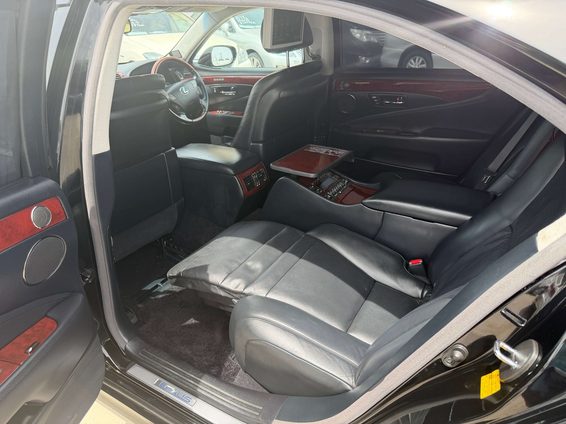 Interior view of a 2007 Lexus LS600hL AWD V8 5.0L Hybrid luxury sedan showcasing separate rear seats.