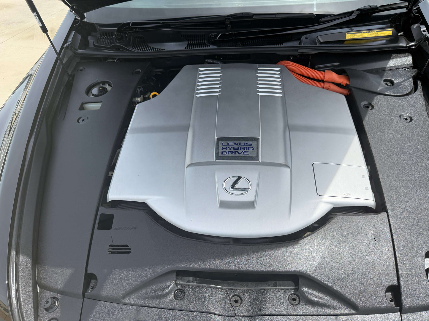 2007 Lexus LS600hL AWD V8 5.0L Hybrid engine compartment with Hybrid Drive emblem.