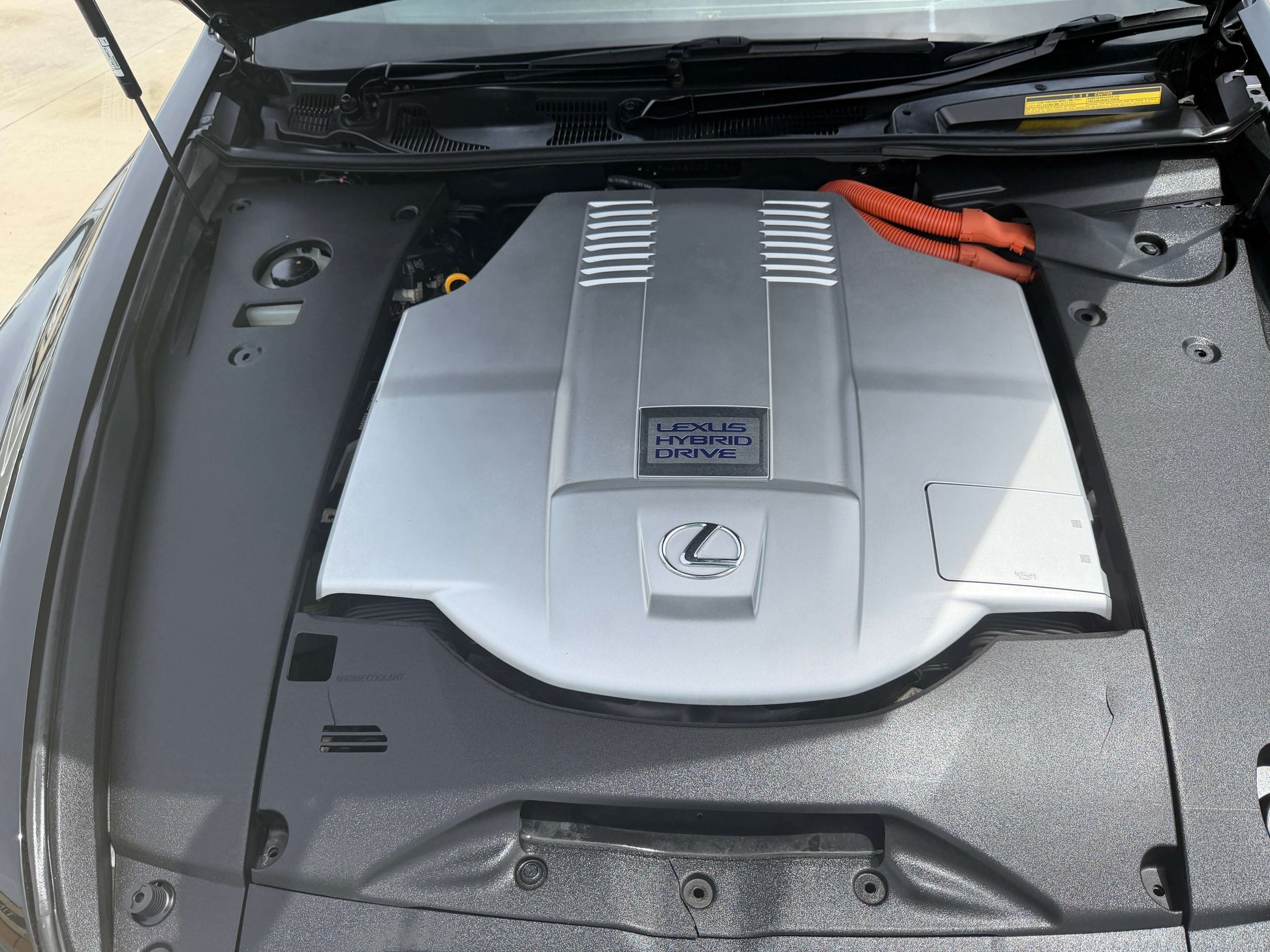 2007 Lexus LS600hL AWD V8 5.0L Hybrid engine compartment with Hybrid Drive emblem.
